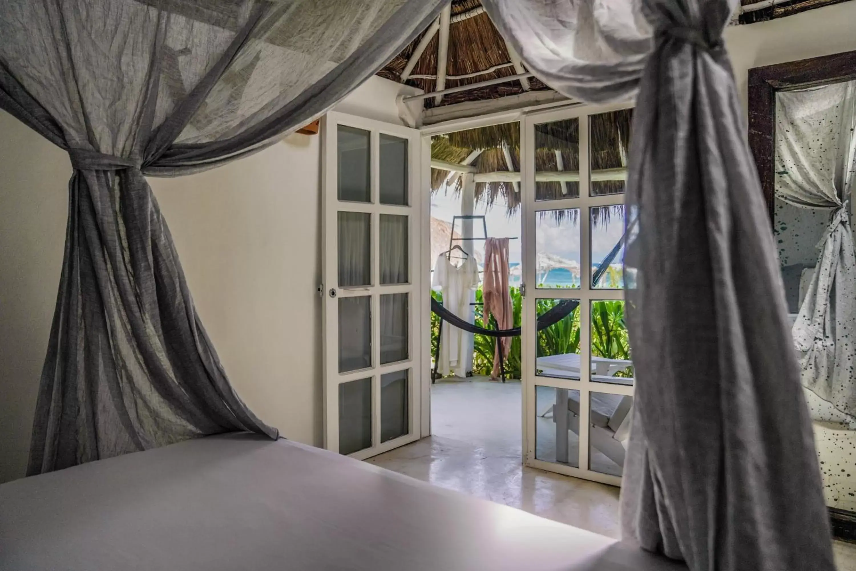 Bed, Pool View in Coco Tulum Zen Zone Hotel