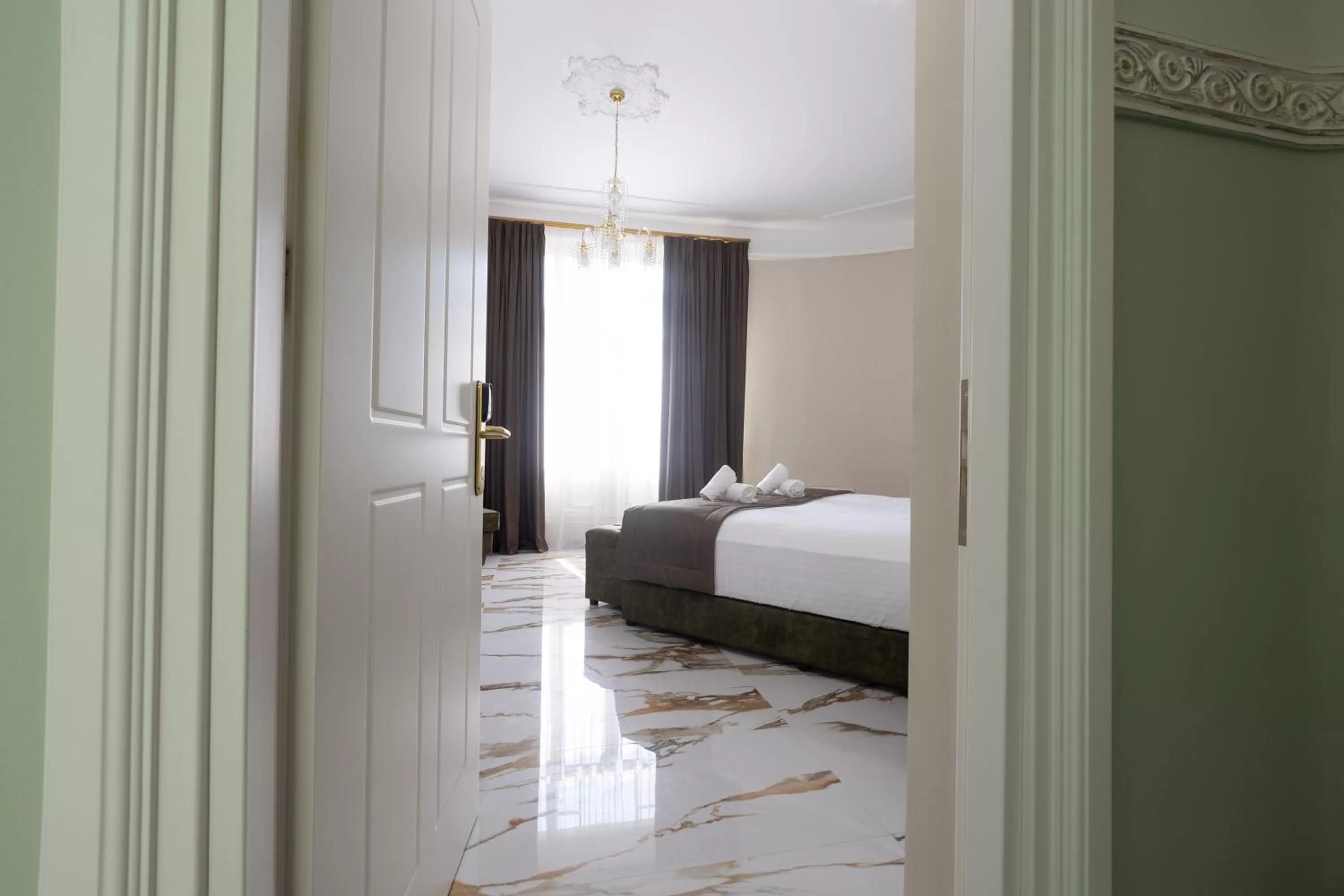 Bed in Modern Revival Luxury Hotel