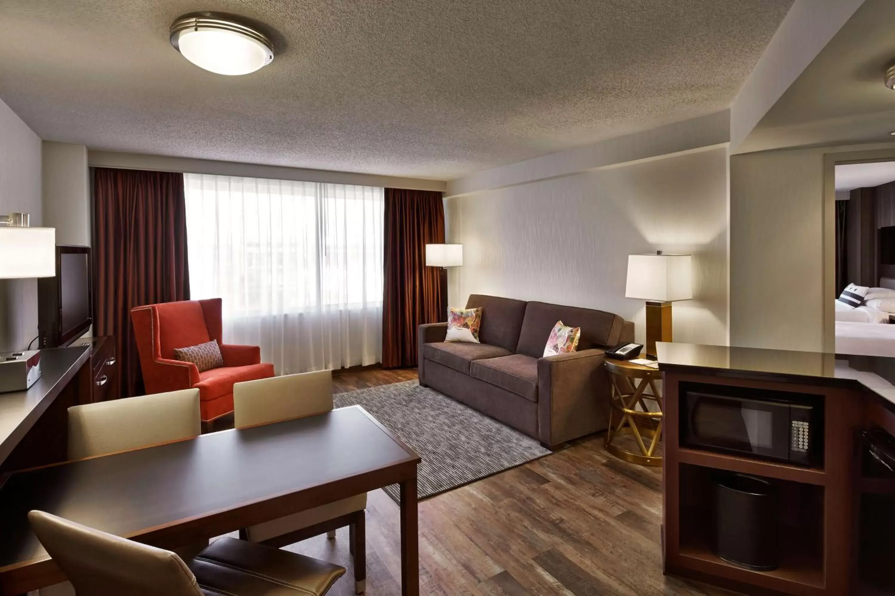 Living room, Seating Area in Embassy Suites by Hilton Washington DC Chevy Chase Pavilion