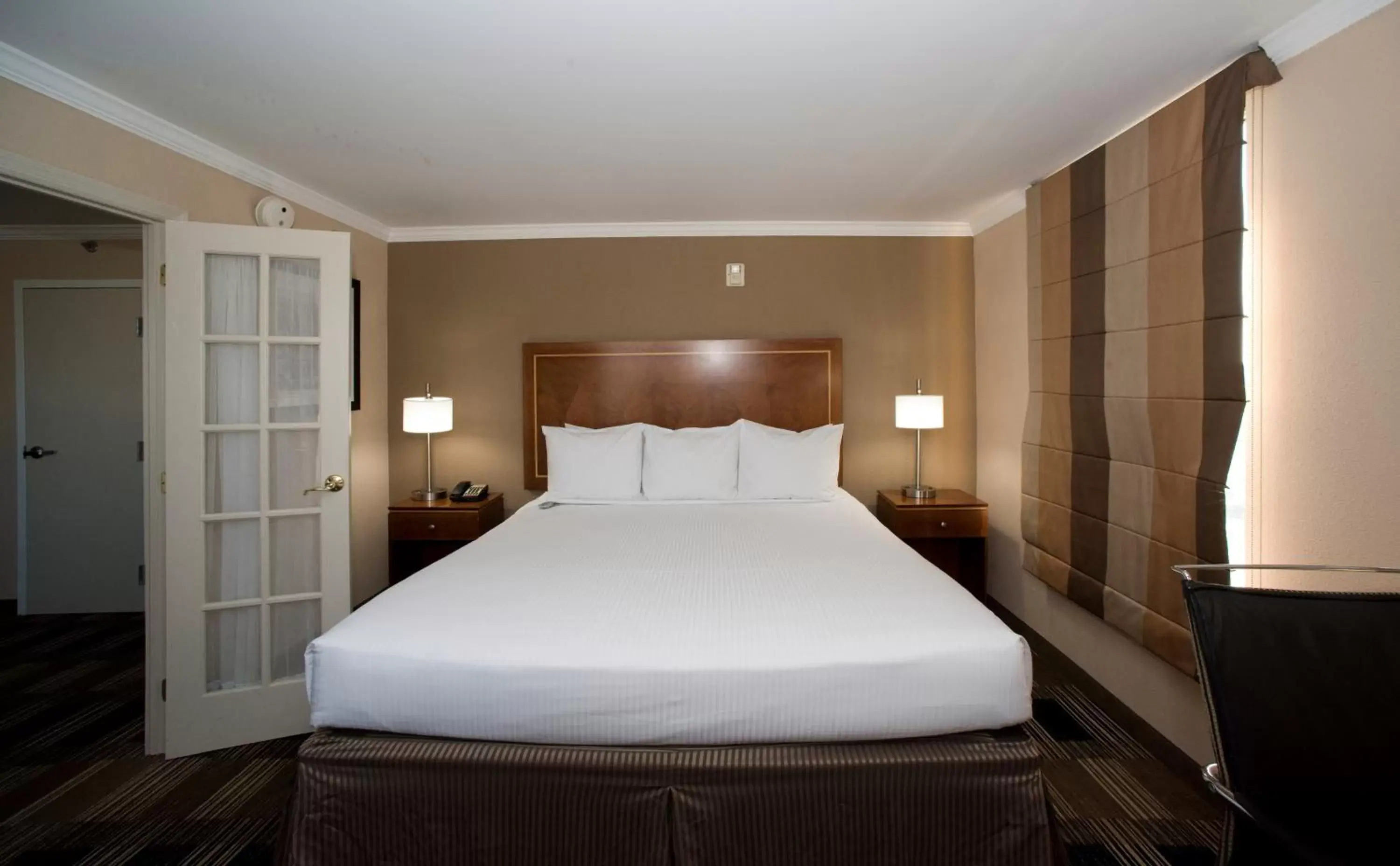 Bed in Hotel Executive Suites