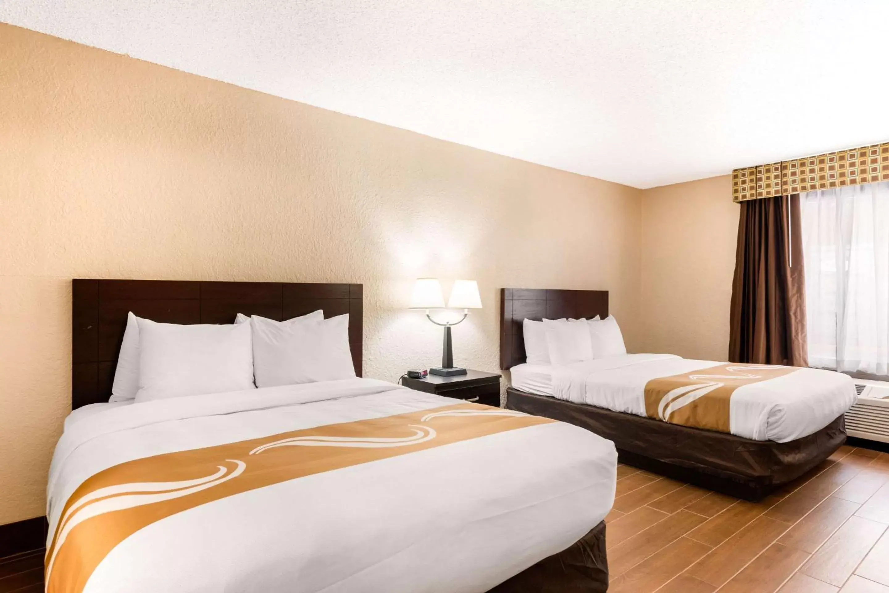 Photo of the whole room, Bed in Quality Inn & Suites Orlando Airport