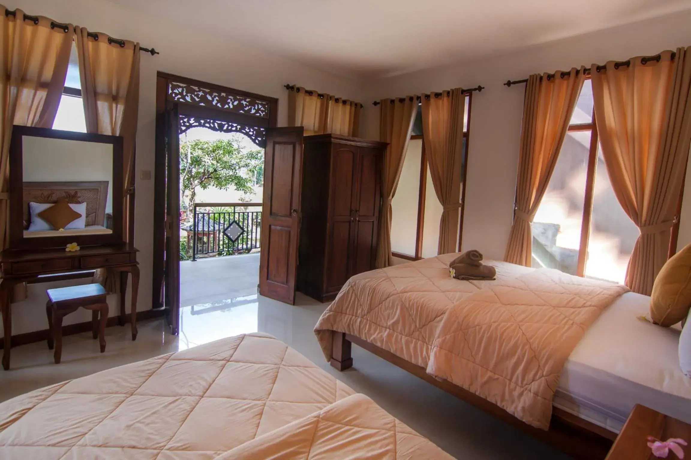 Deluxe Triple Room in Ganesha Ubud Inn