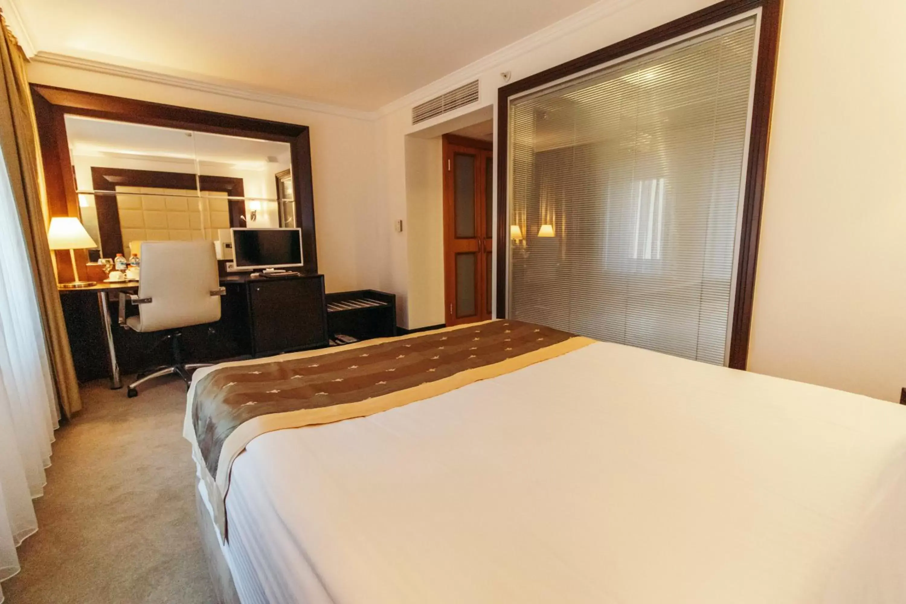 Bed in CK Farabi Hotel