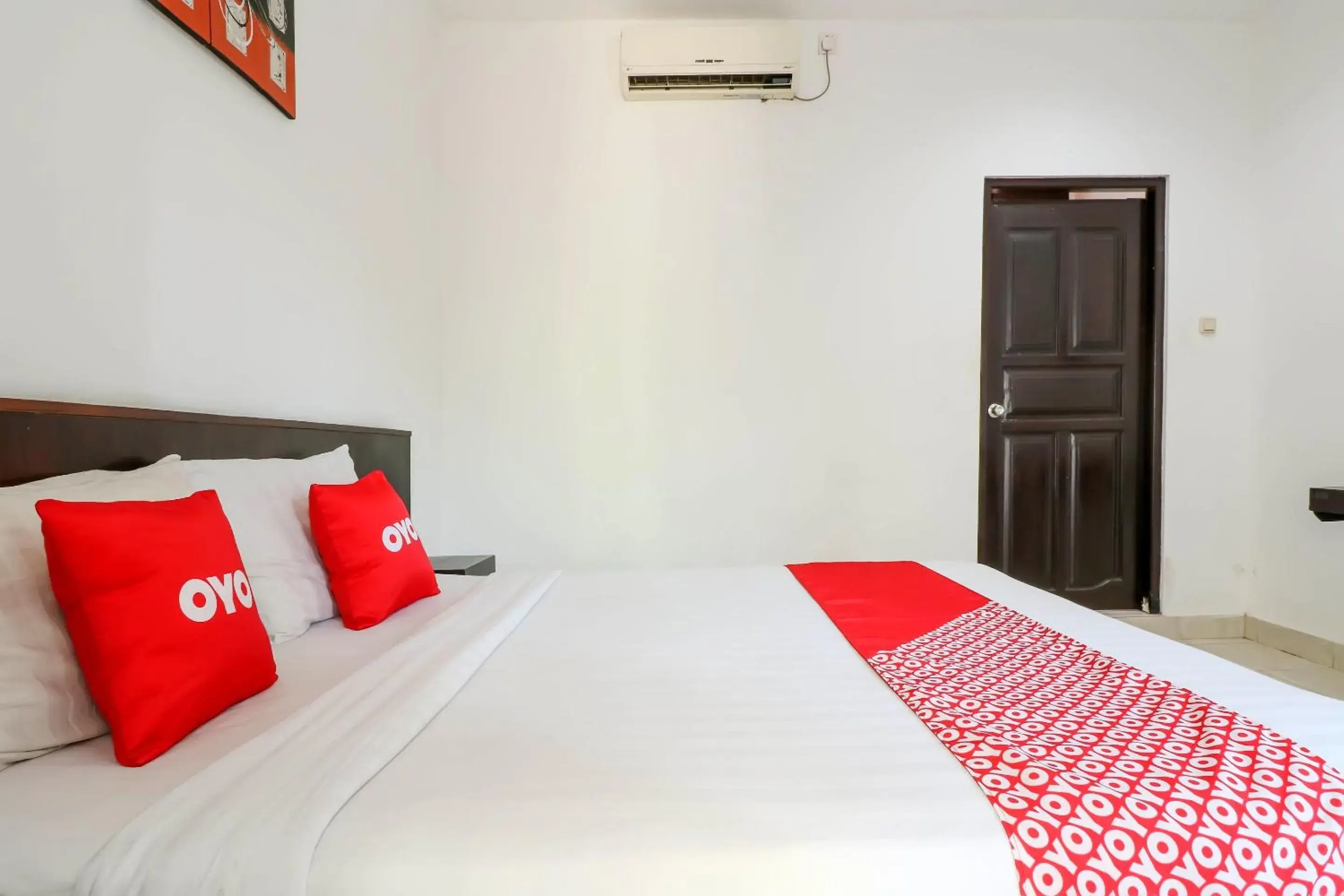 Bedroom in OYO 1666 Grand Pudjawan Hotel