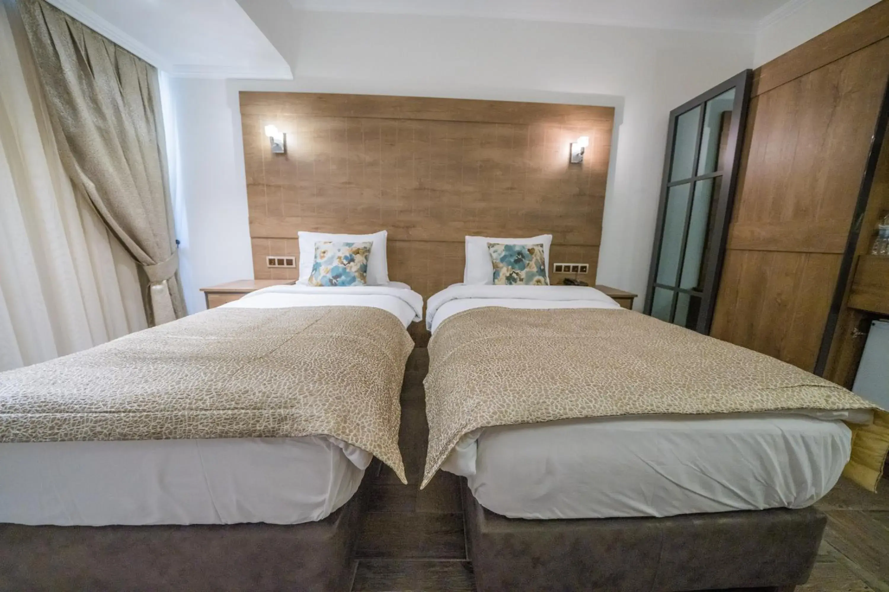 Bed in Aurasia Beach Hotel