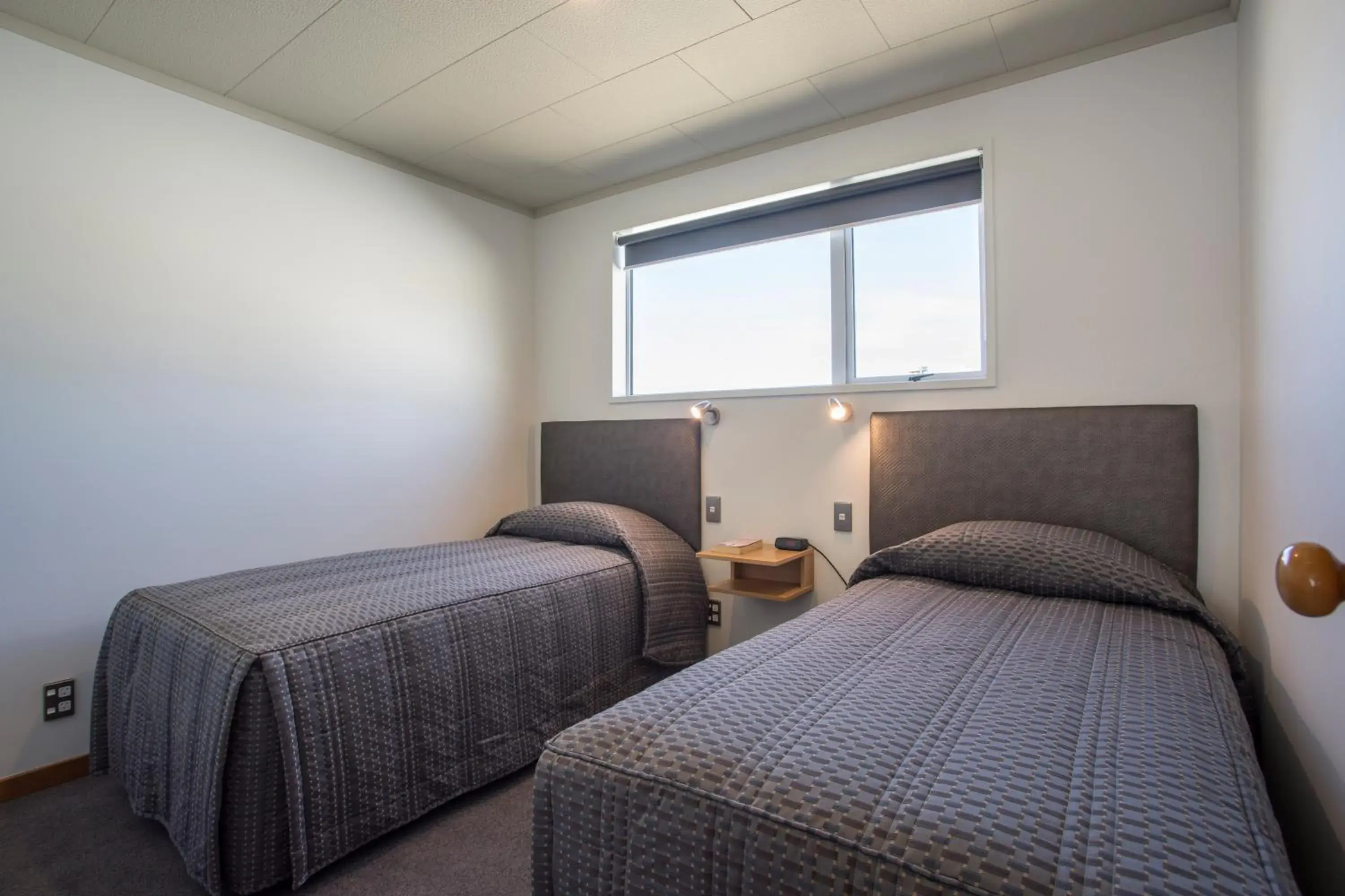 Bed in Dunedin Motel and Villas
