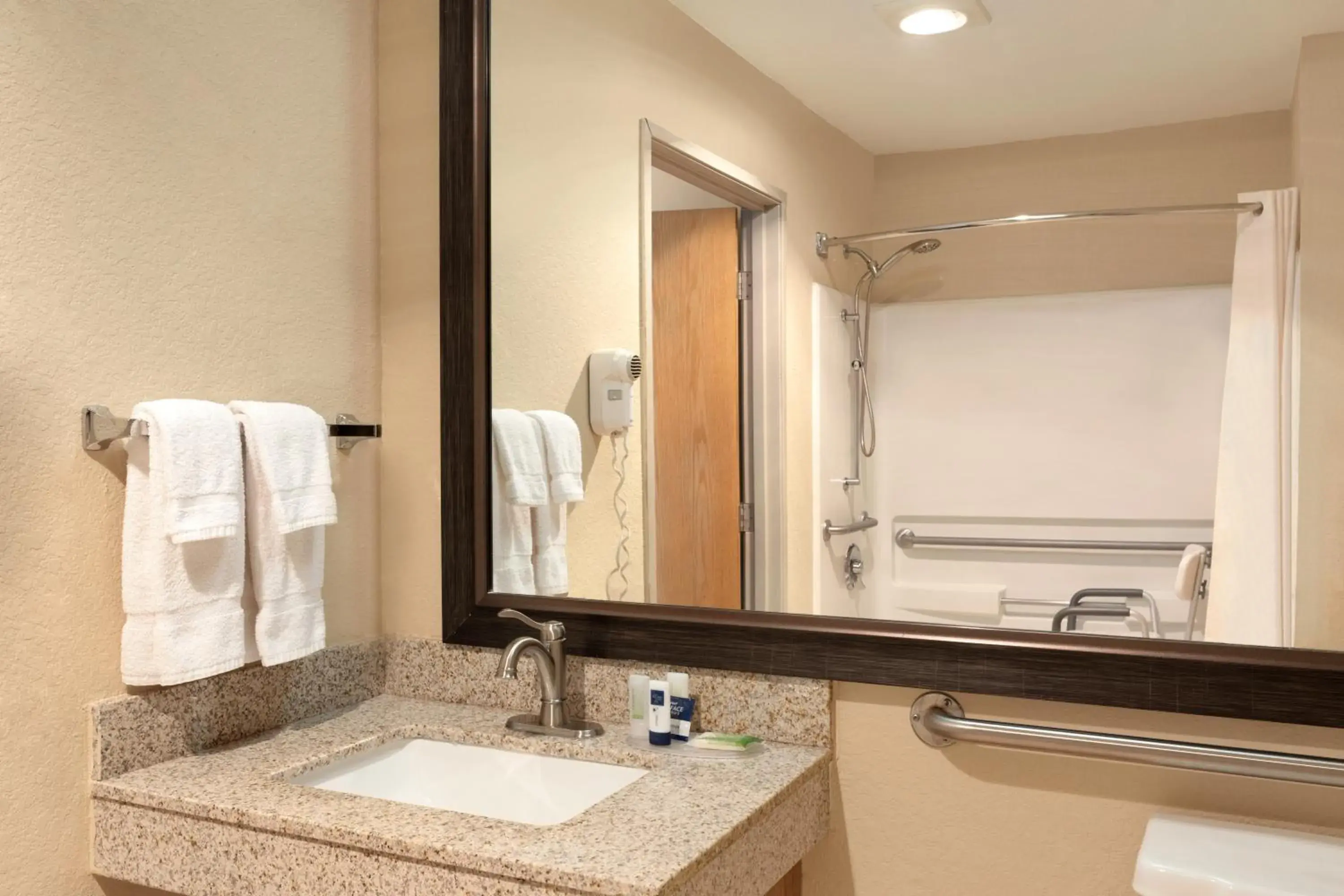 Bathroom in AmericInn by Wyndham Salina