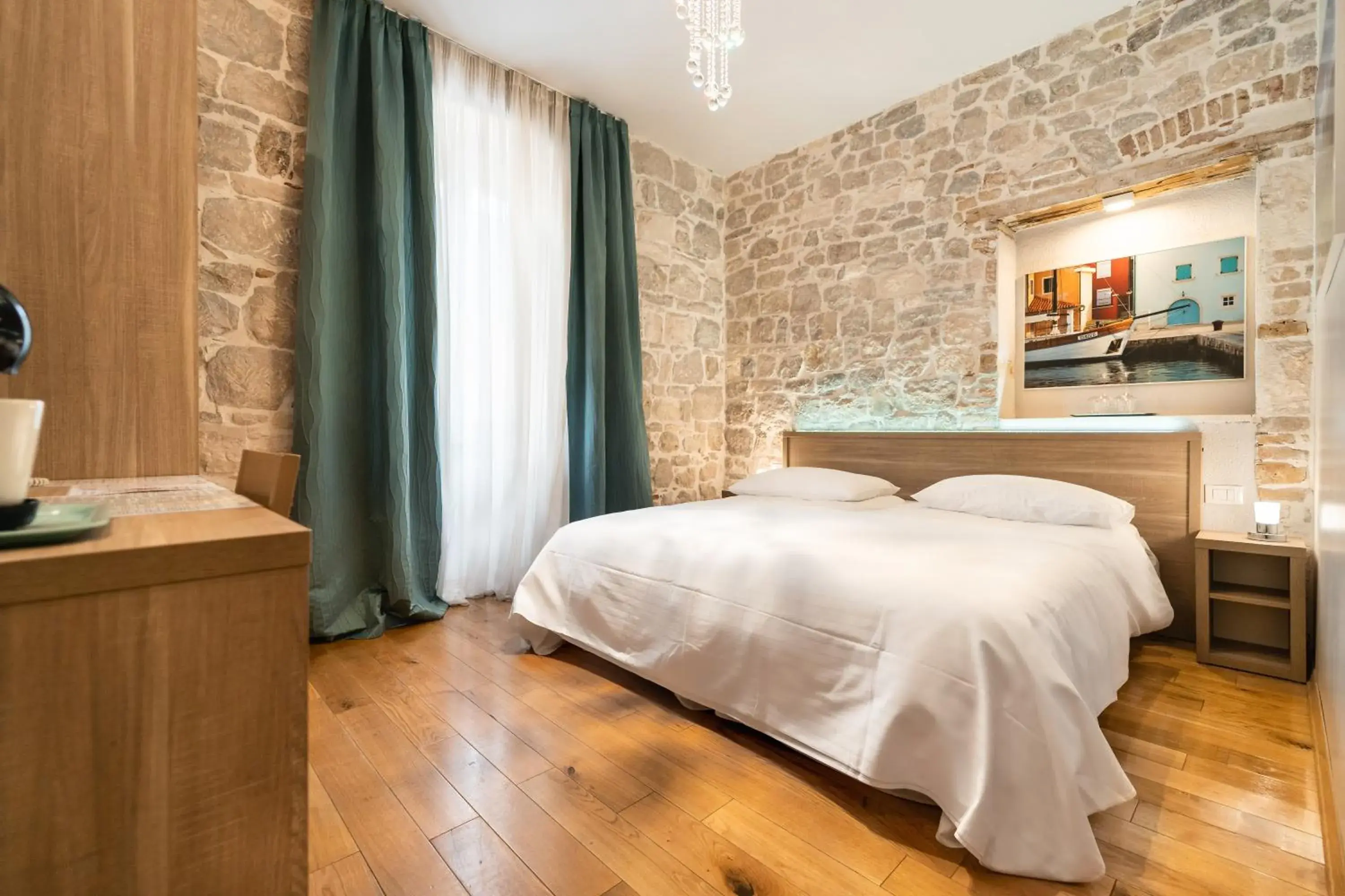 Bed in Tifani Luxury Rooms