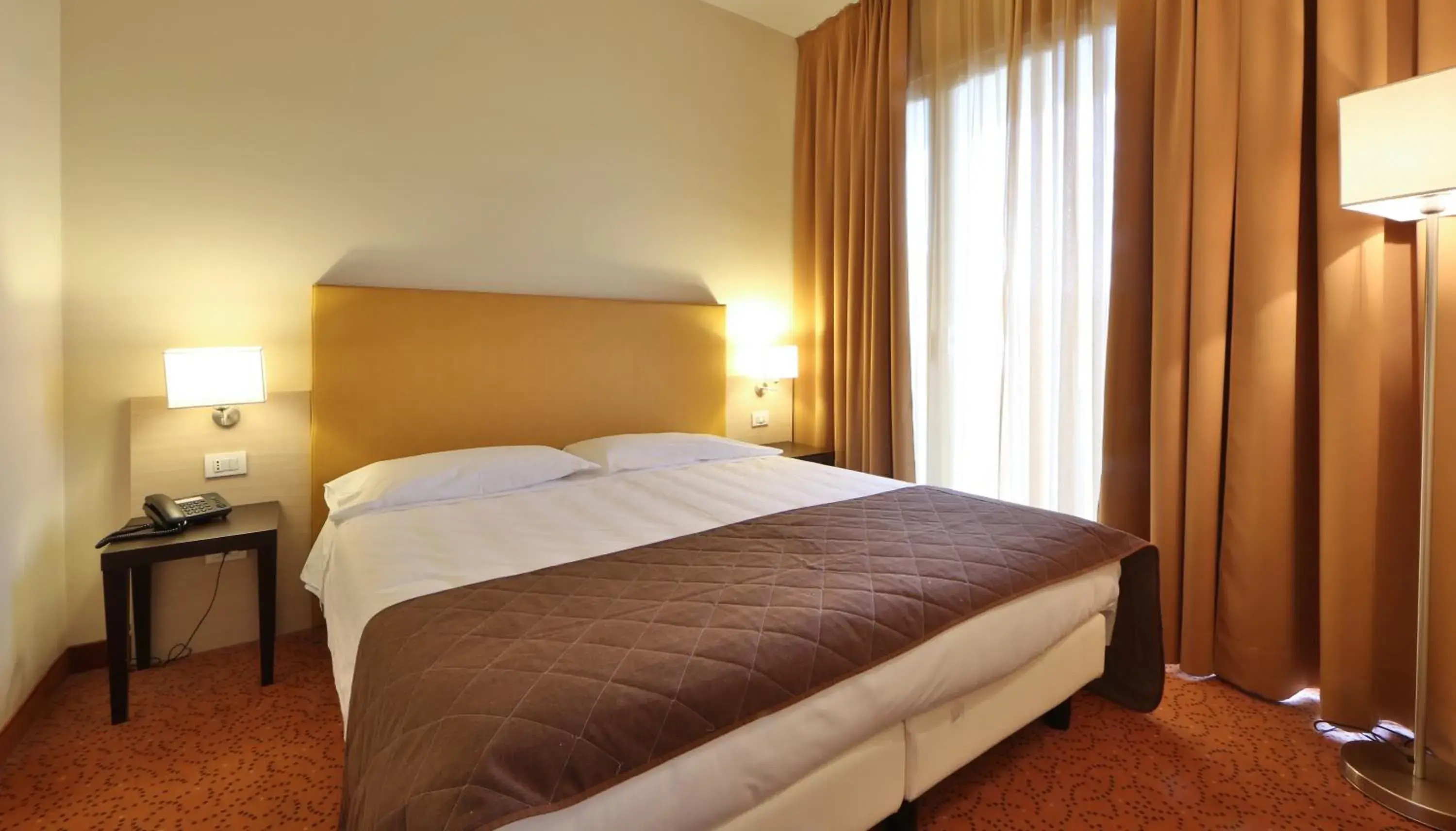 Bed in Regal Hotel & Residence