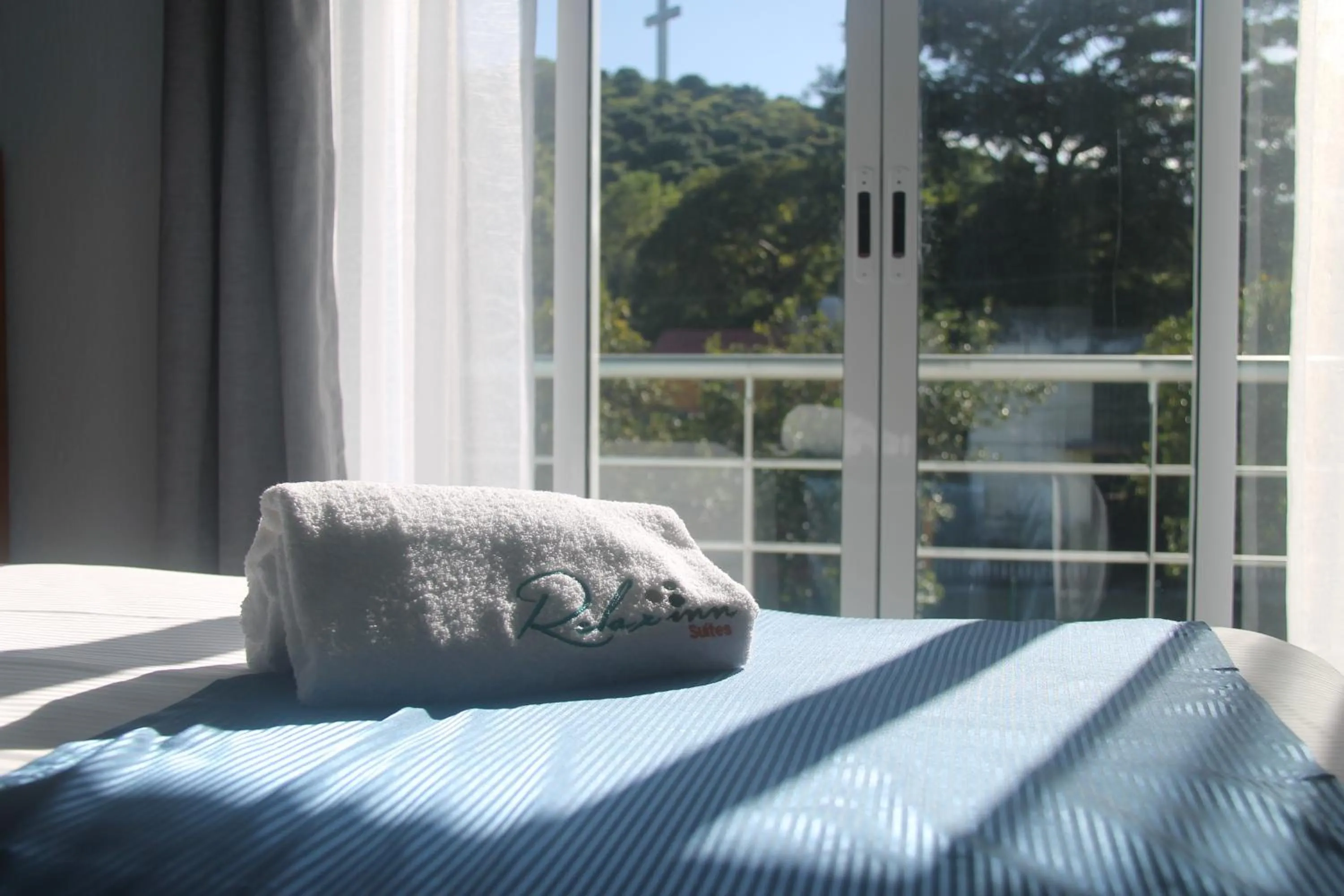 Bed in Relax Inn Suites