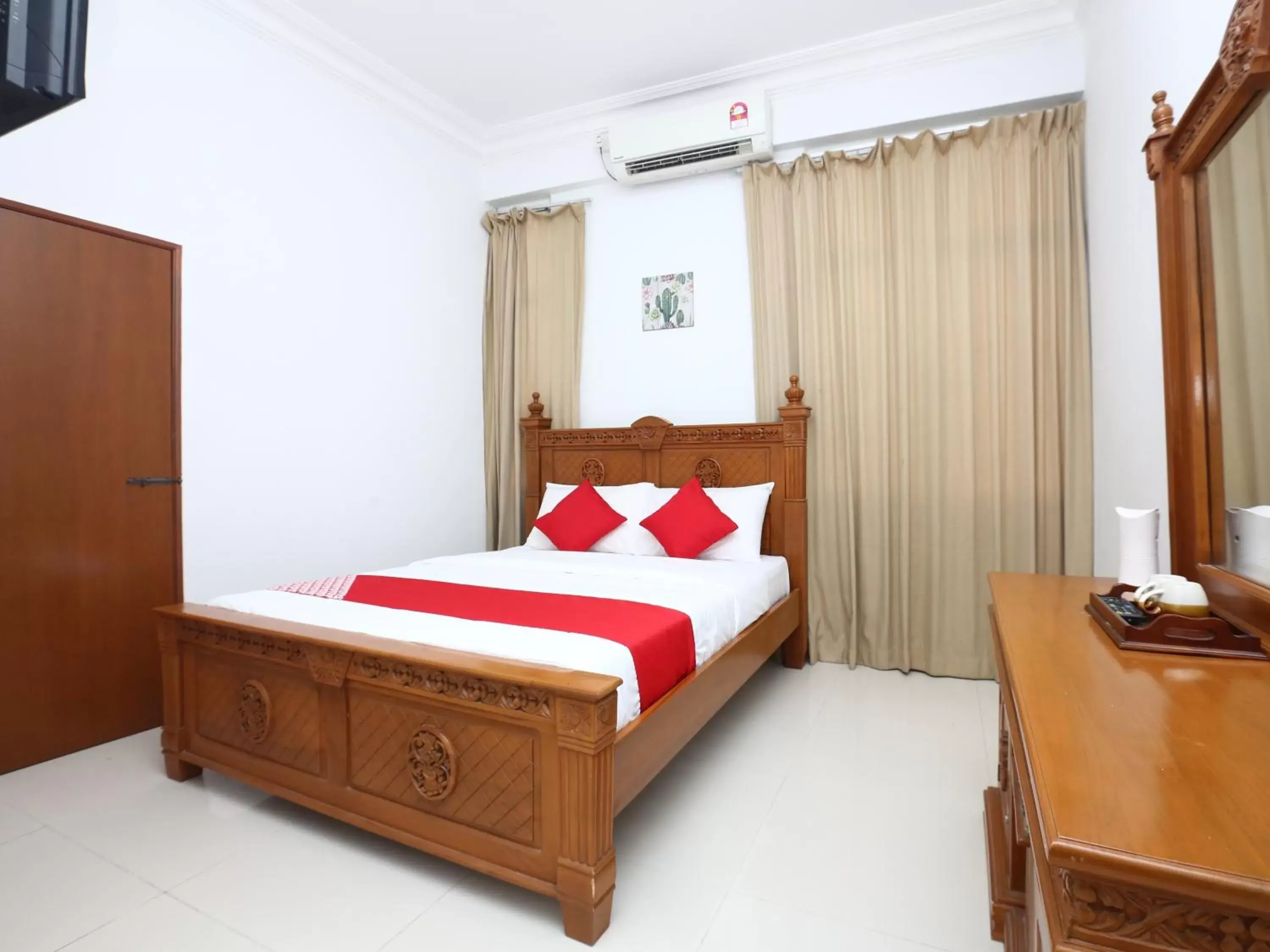 Bedroom in OYO 89435 Nusantara Group Hotel