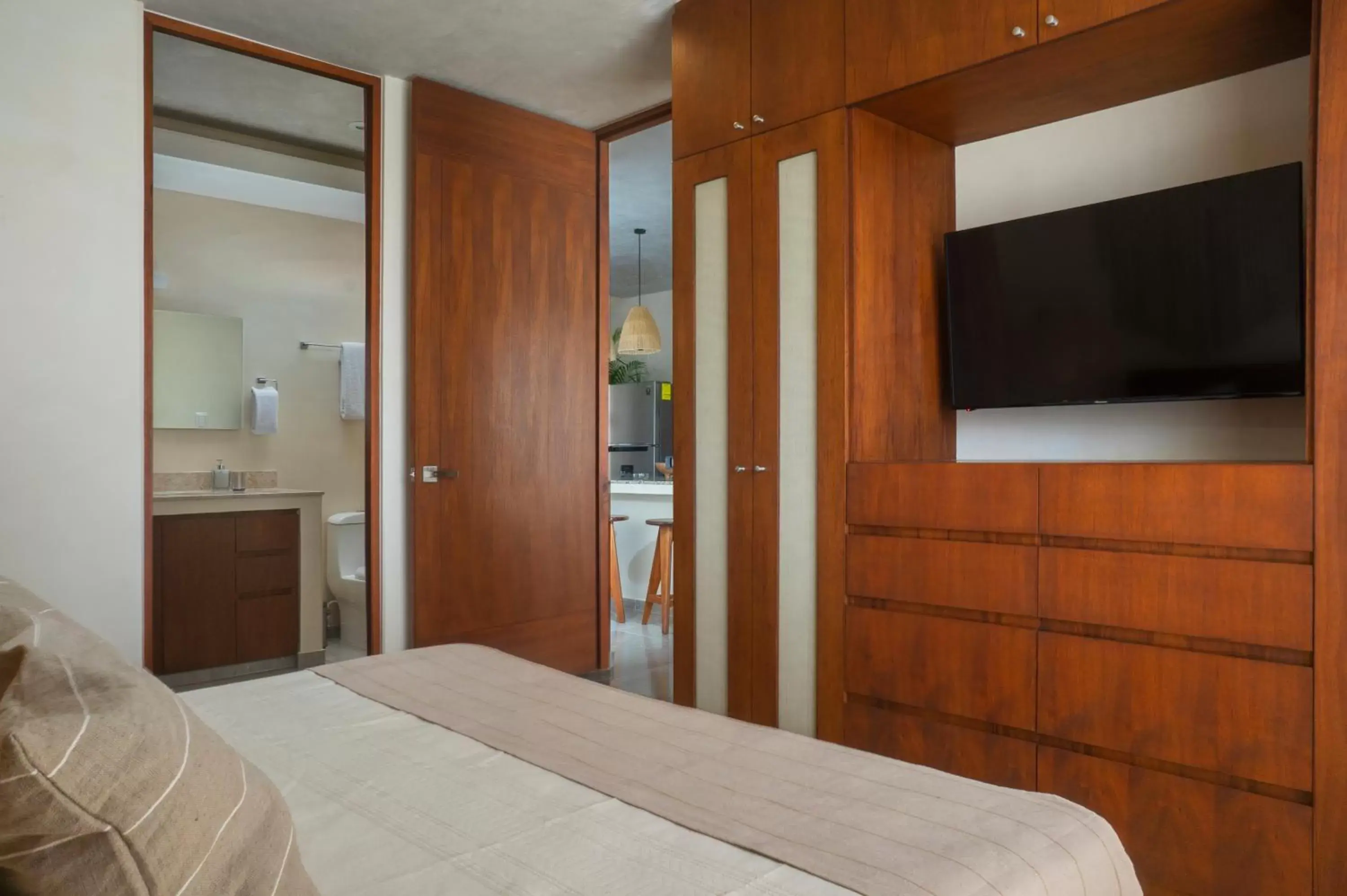 Bed, TV/Entertainment Center in ARUNA TULUM-Luxury Studios & Apartments