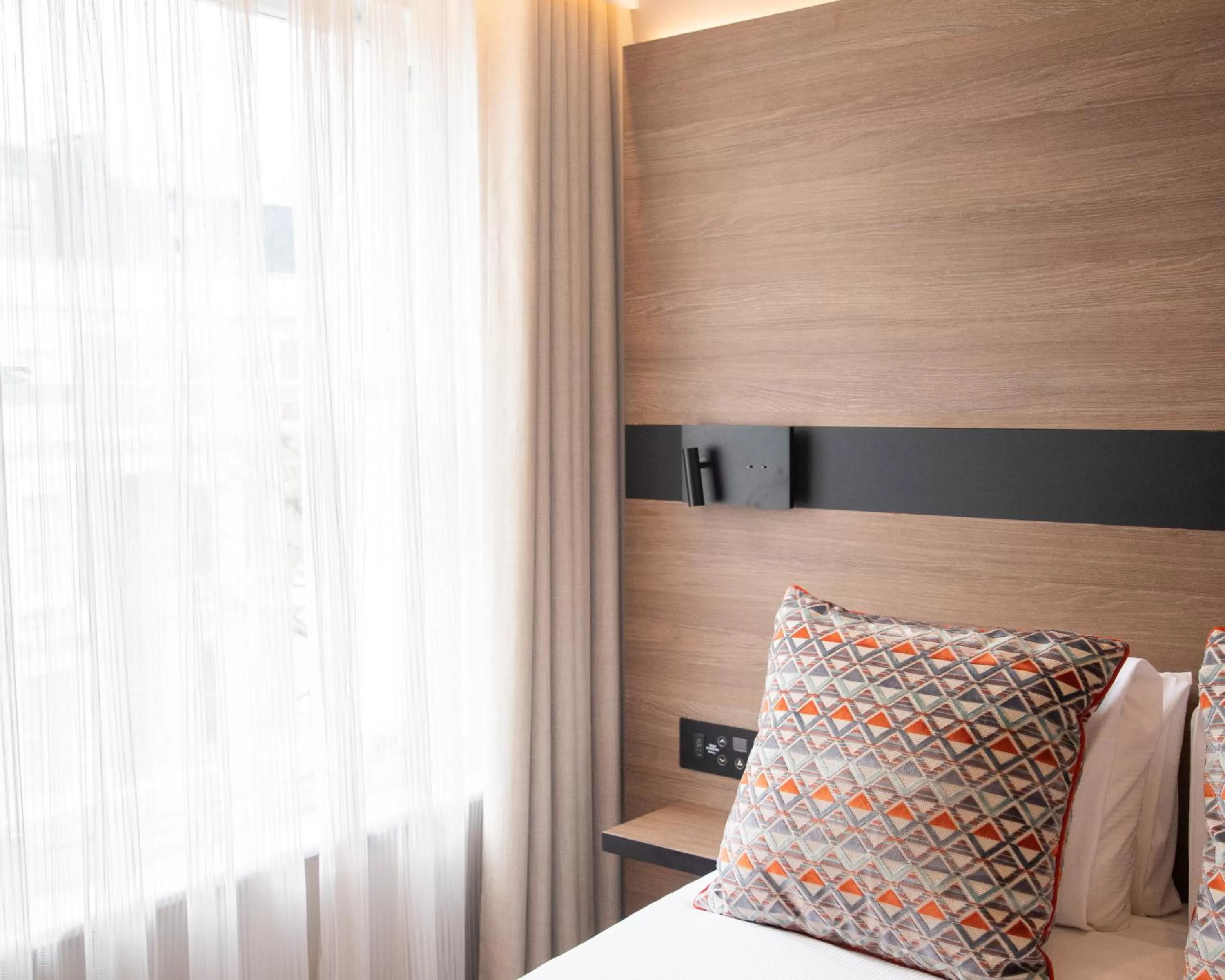 Bed in Merit Kensington Hotel