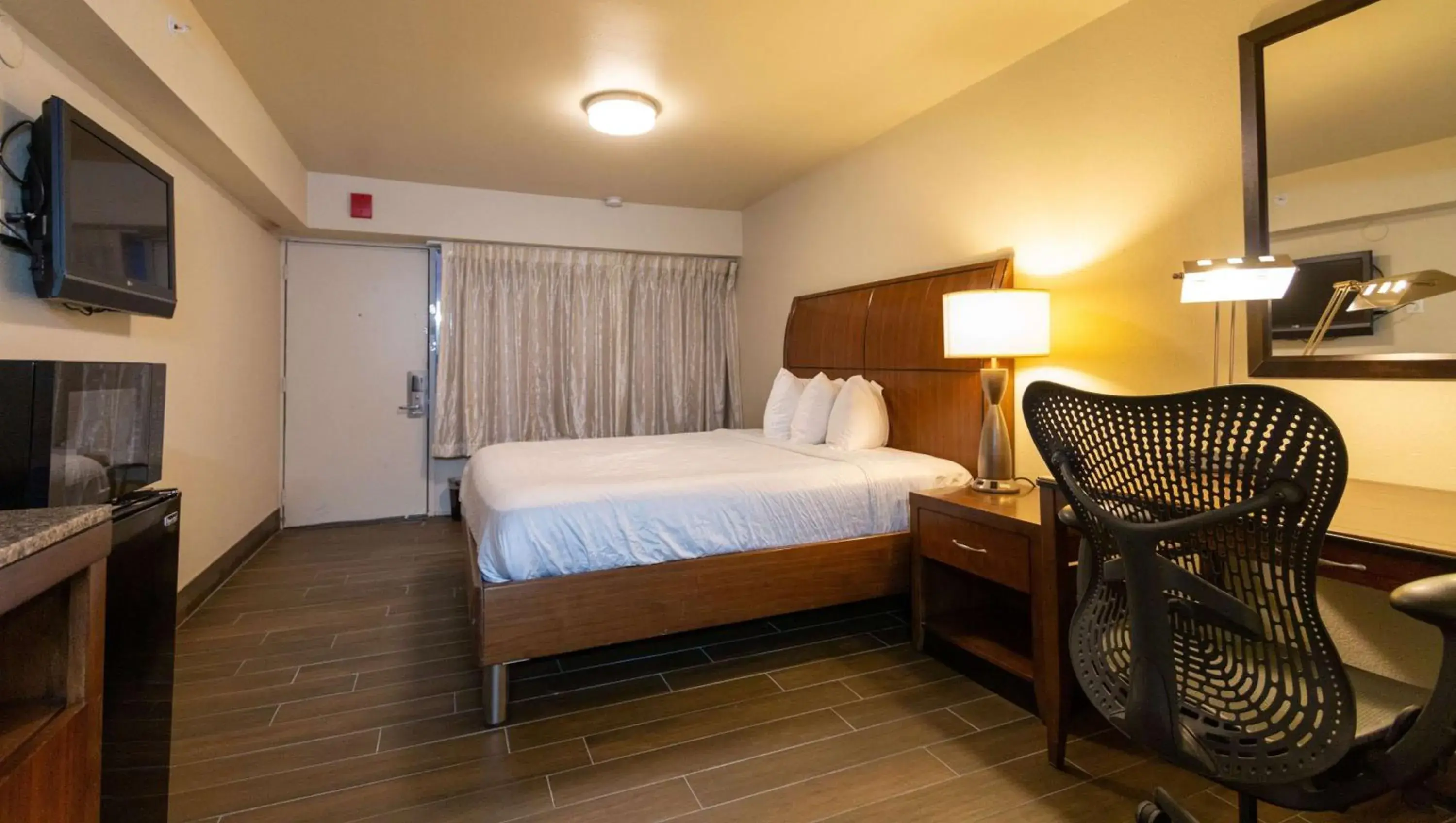 Photo of the whole room in Magnuson Extended Stay and Suites Airport Hotel