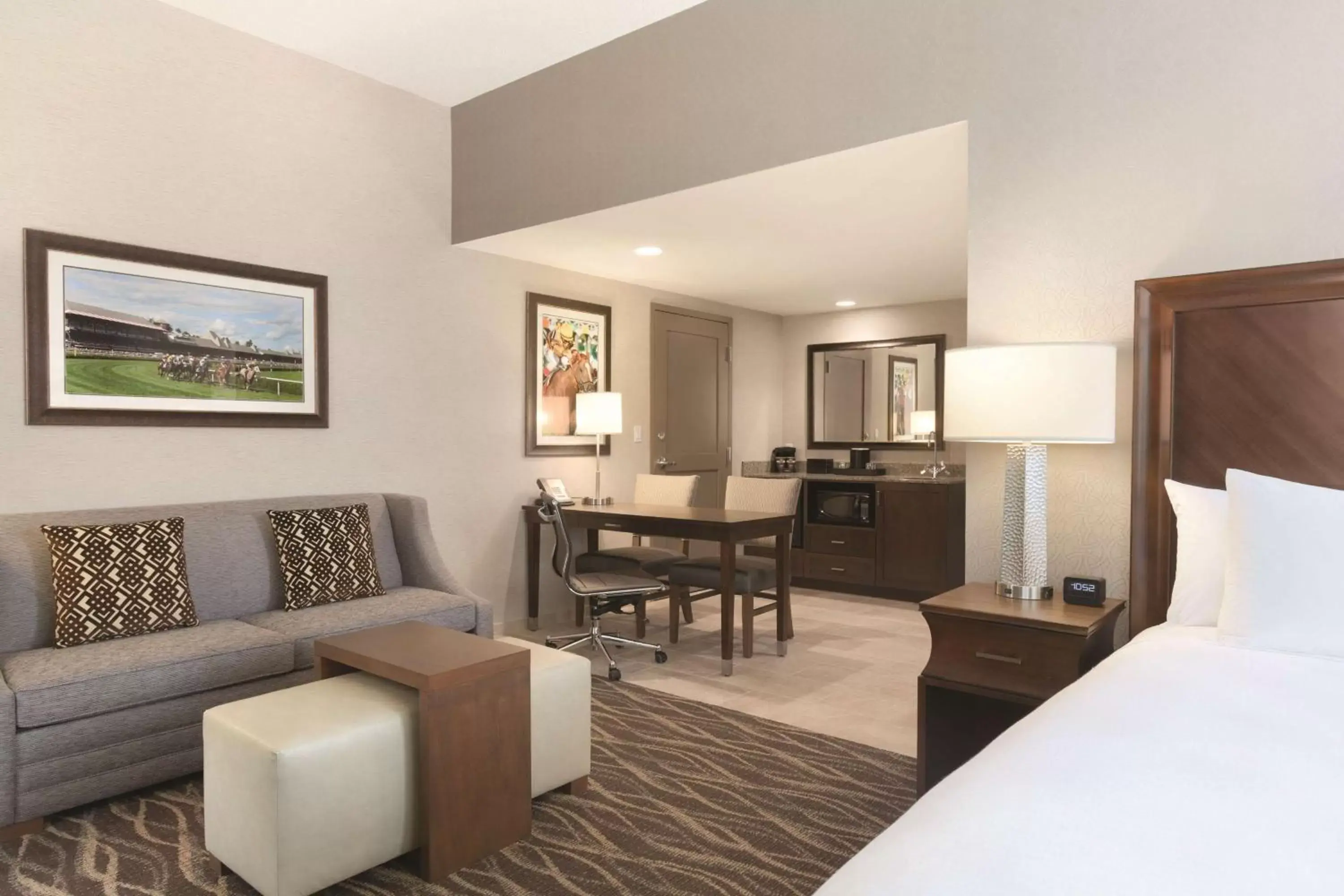 Bed, Seating Area in Embassy Suites Saratoga Springs