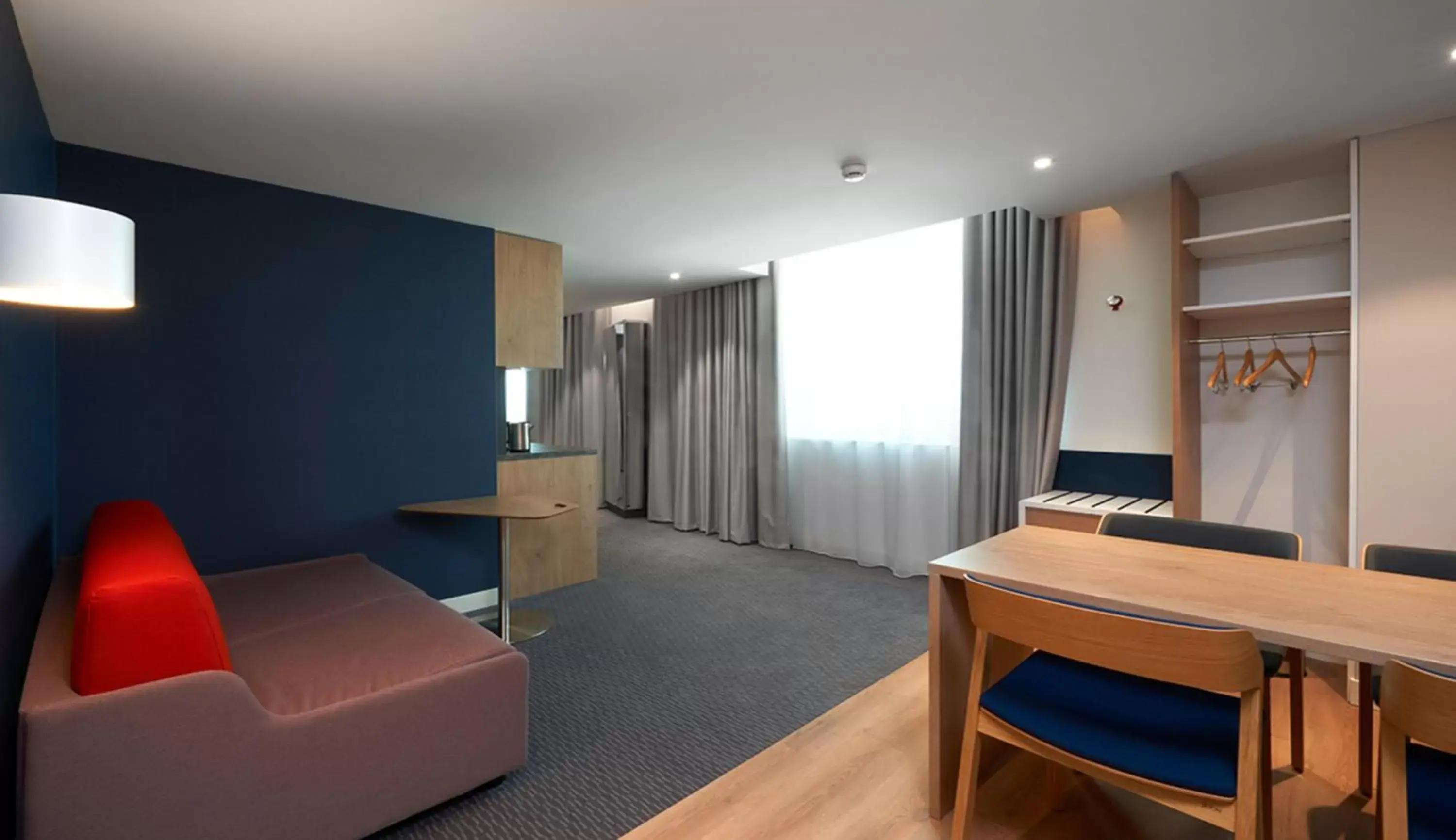 Photo of the whole room, Seating Area in Holiday Inn Express & Suites - Basel - Allschwil, an IHG Hotel