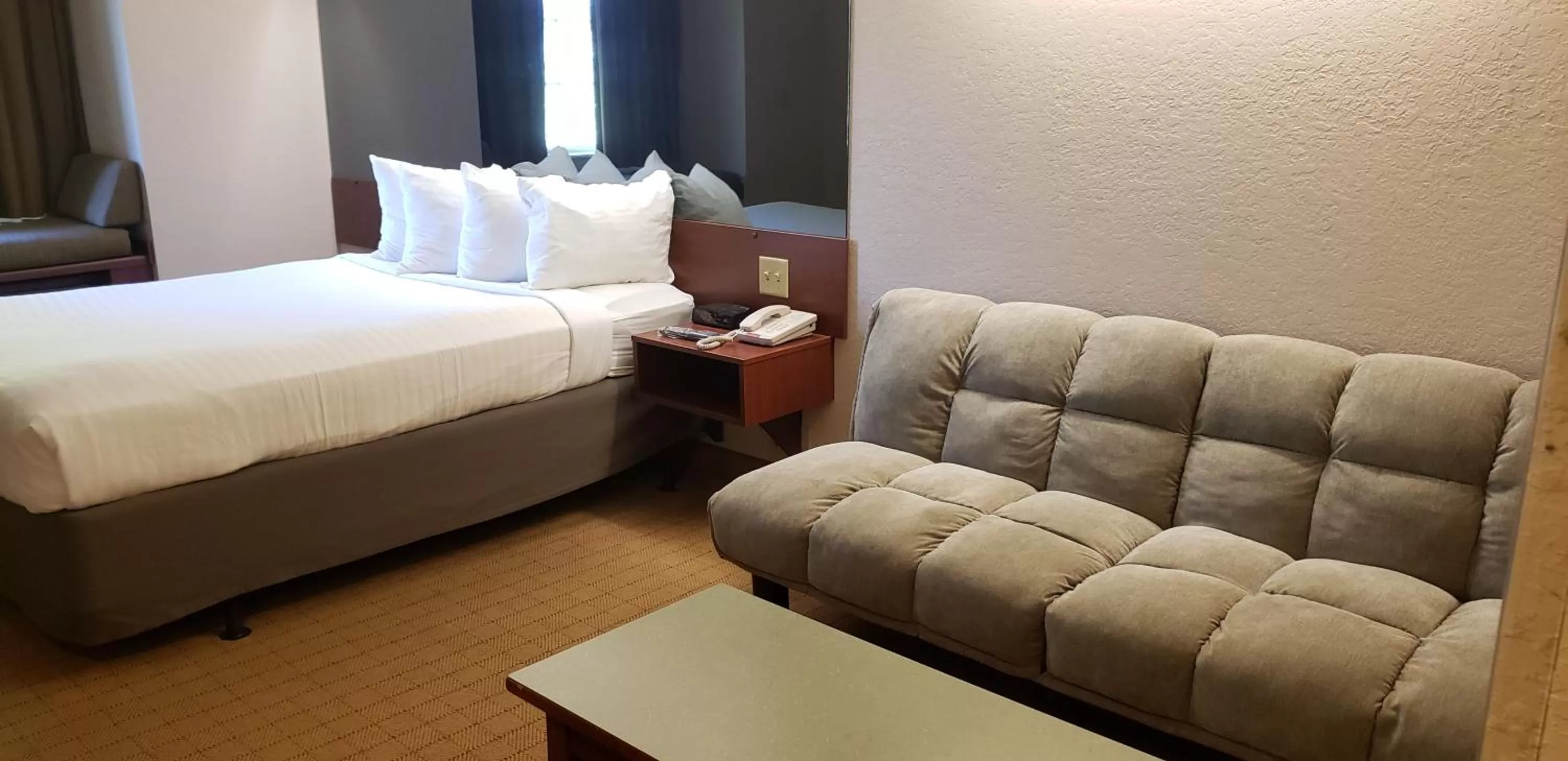 Bed in Microtel Inn & Suites by Wyndham Wellsville