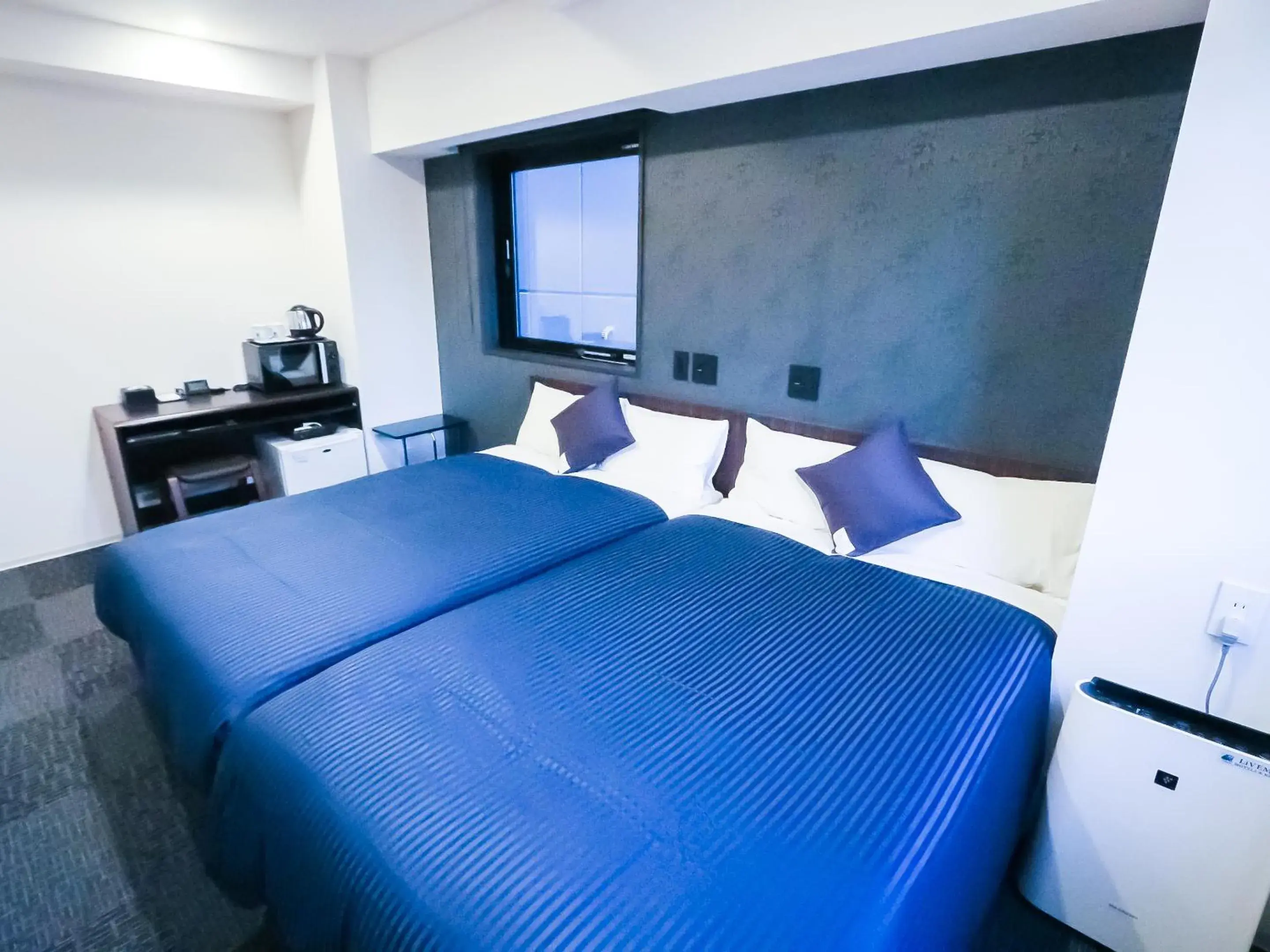 Bed in Hotel Livemax Tokyo Shintomicho