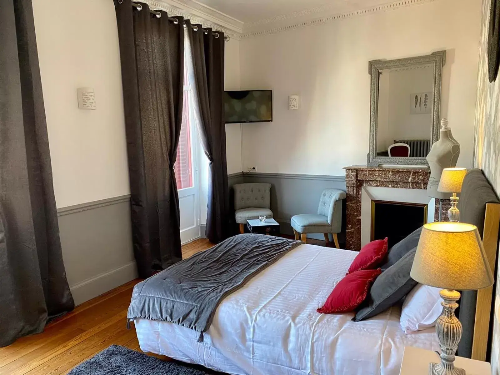 Photo of the whole room, Bed in Logis Hotel La Tourelle du Beffroi