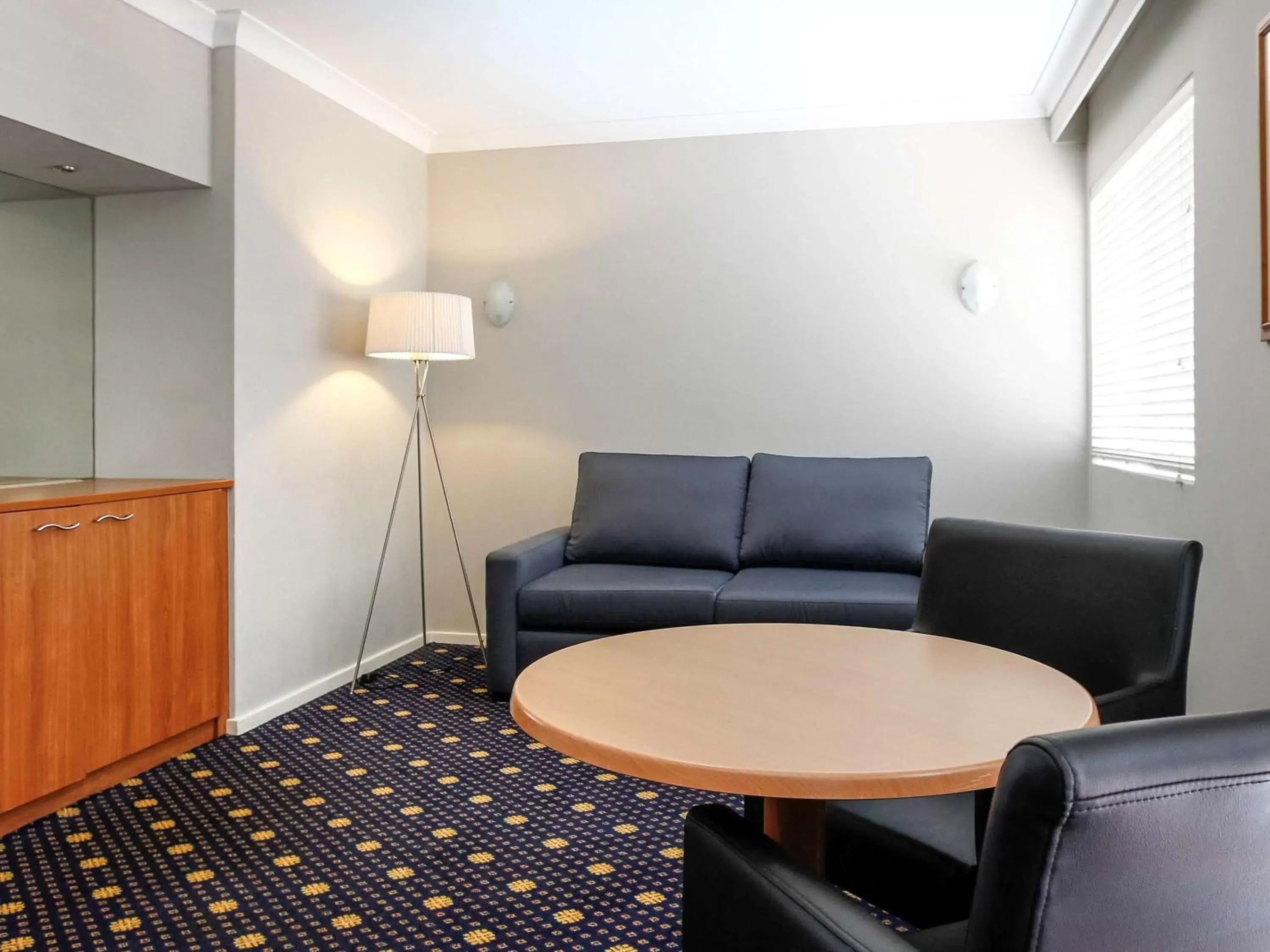Photo of the whole room, Seating Area in Ramada Hotel & Suites by Wyndham Cabramatta