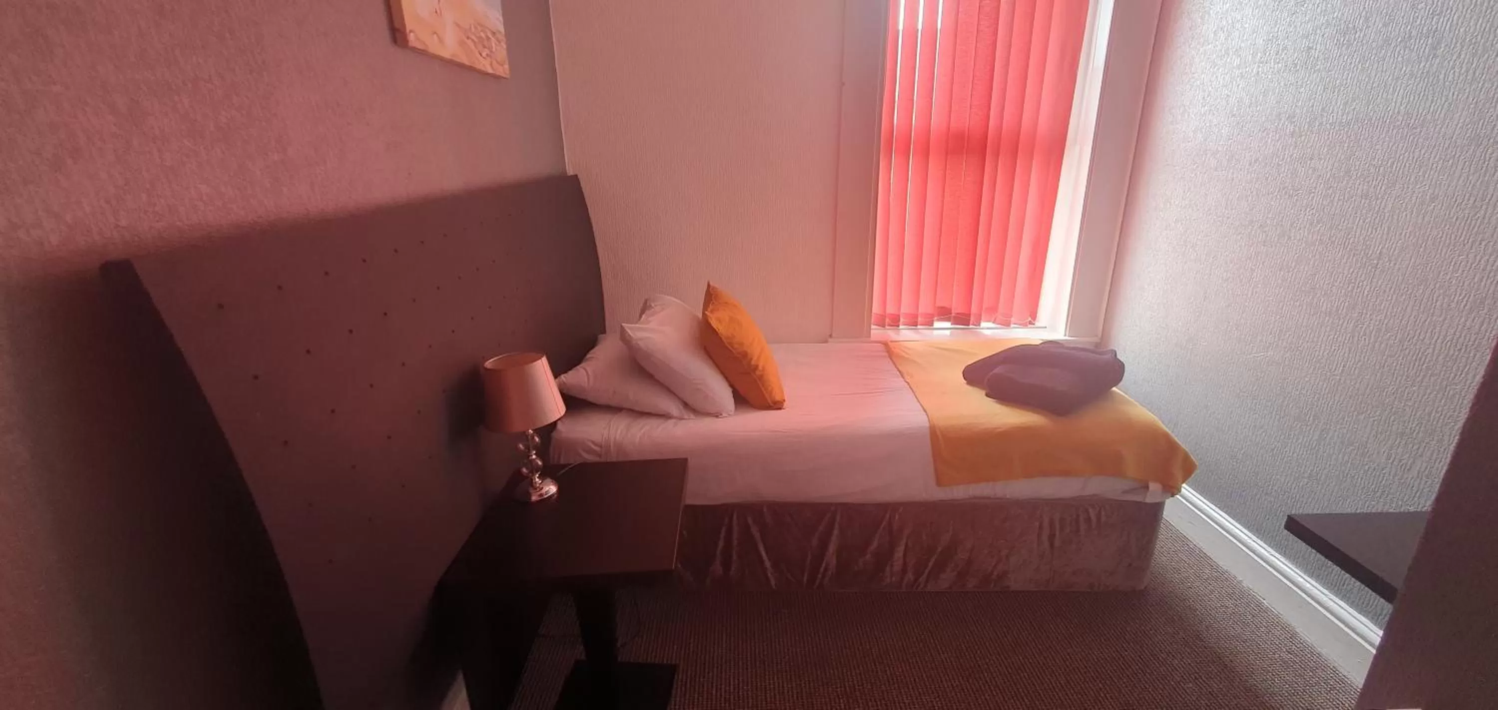 Bed in Palm Beach Hotel by the Sea