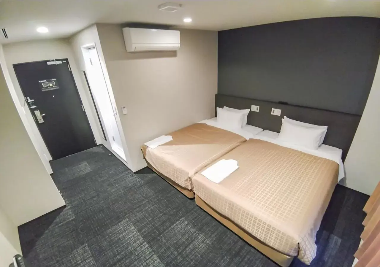 Bed in HOTEL LiVEMAX Kokura Ekimae