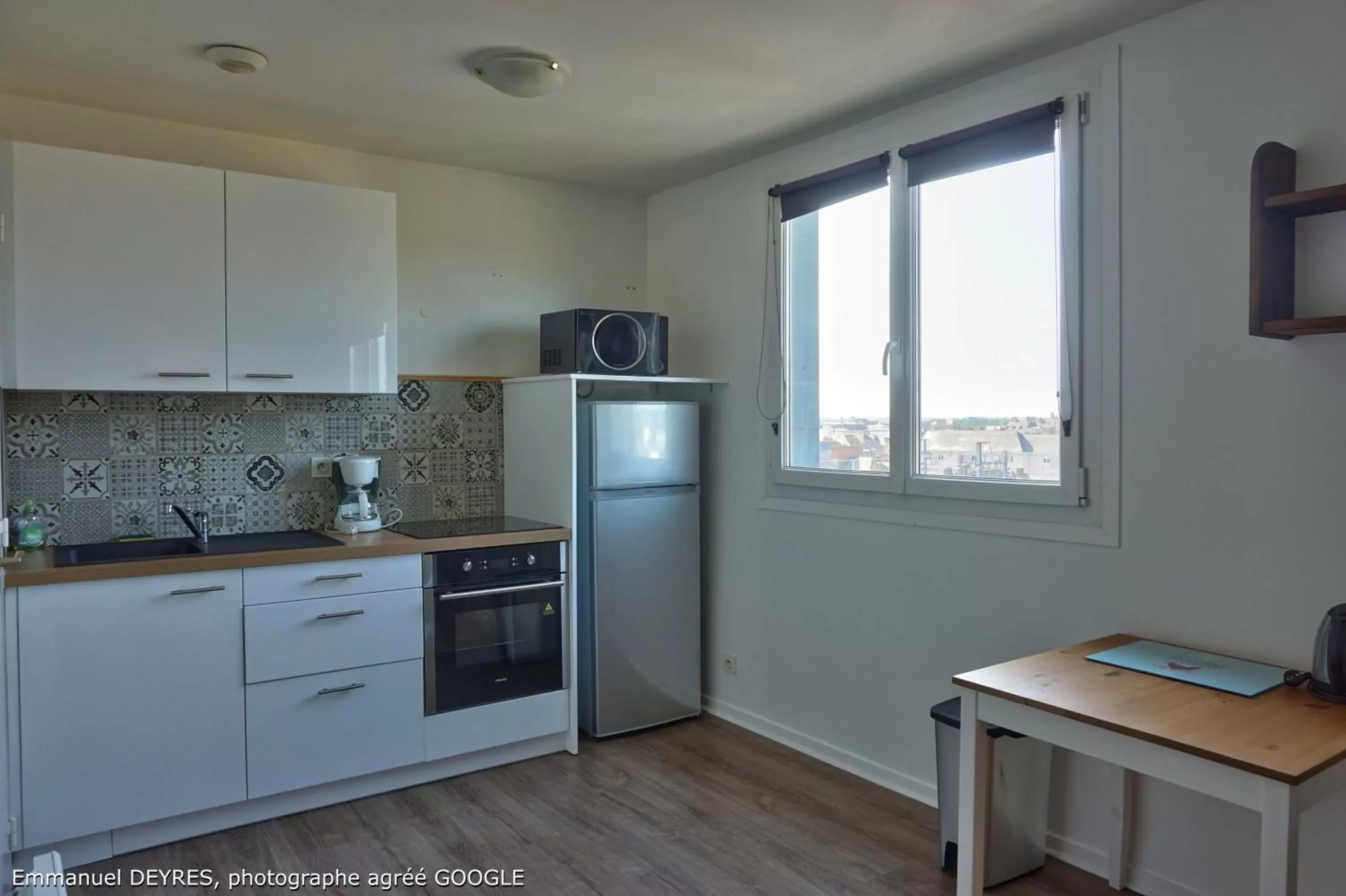 Kitchen/Kitchenette in Queen Serenity Hotel