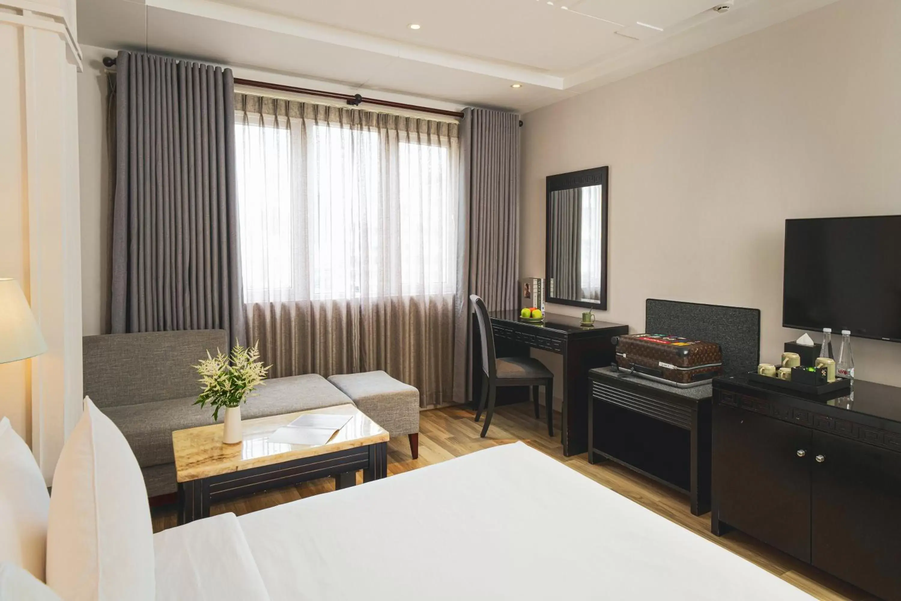 Bedroom, TV/Entertainment Center in Alagon Saigon Hotel & Spa