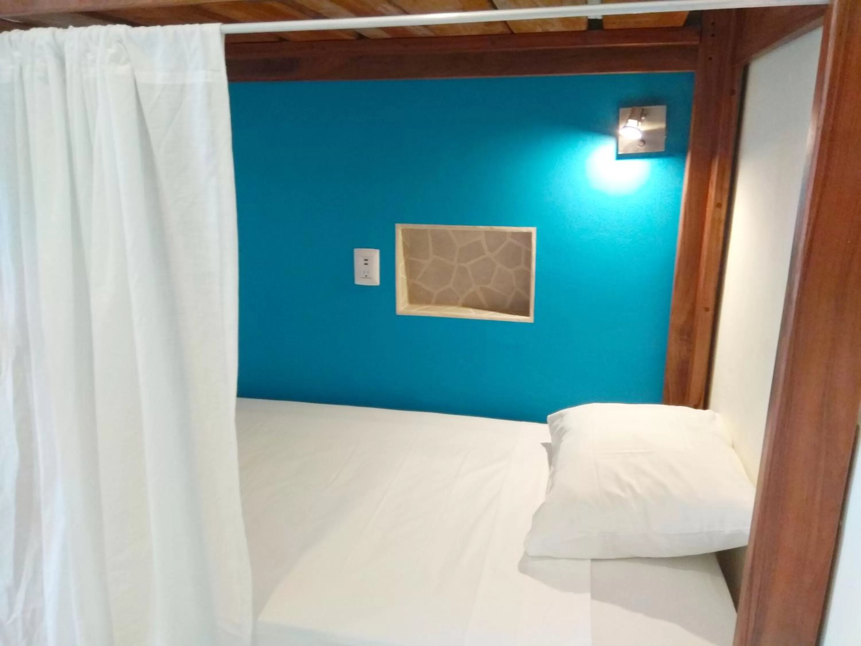 Bed in La Palmita Budget Boutique Hotel