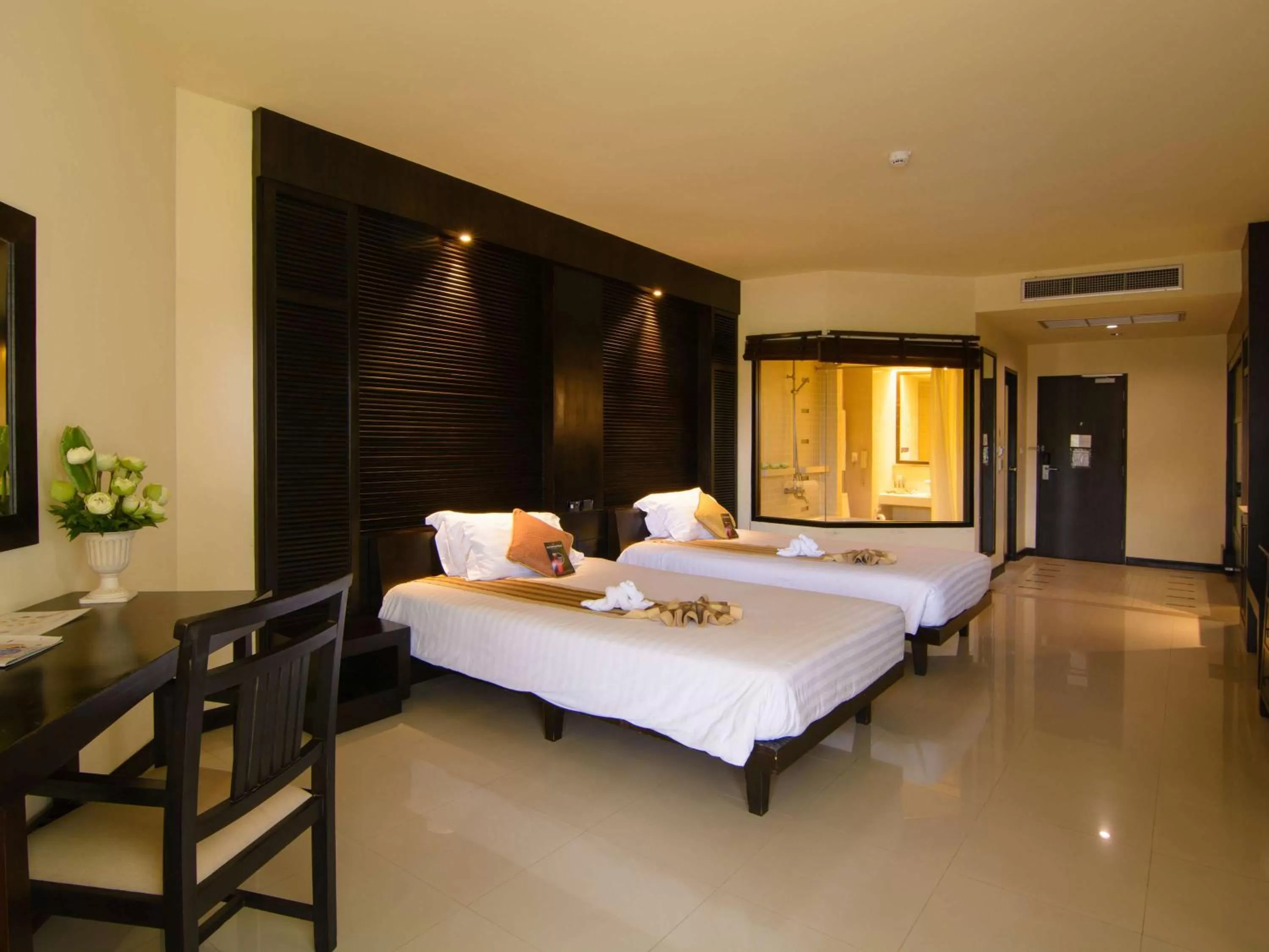 Photo of the whole room, Bed in The Nouveau Chumphon Beach Resort And Golf