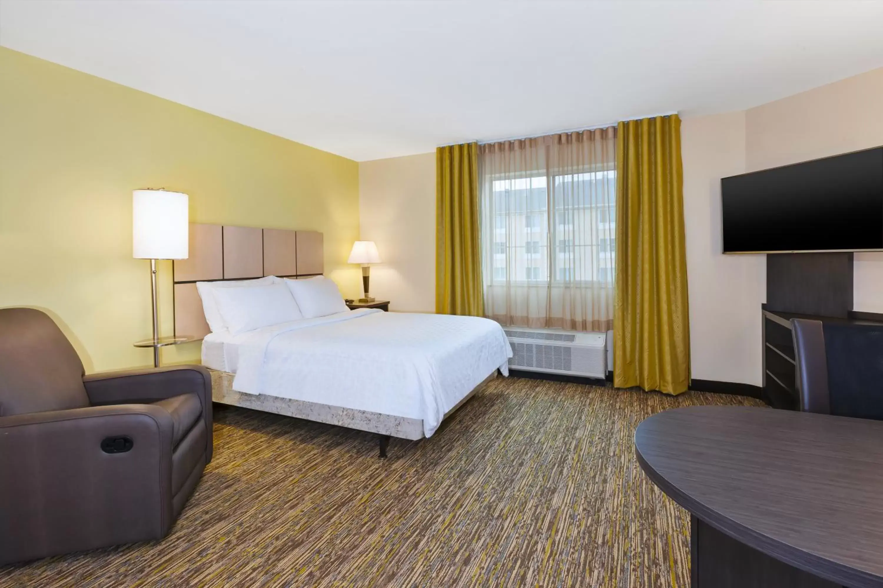 Bedroom in Candlewood Suites Washington North, an IHG Hotel