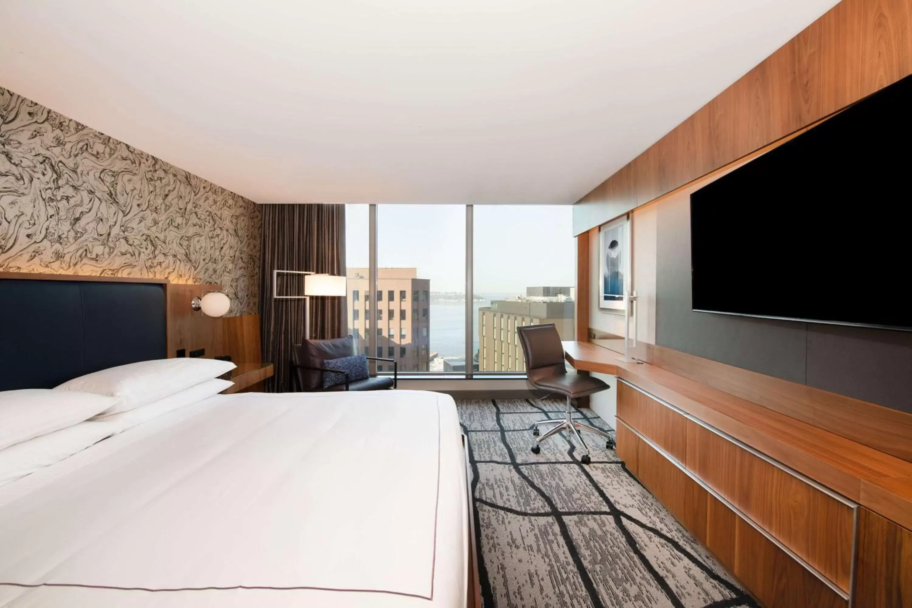 Bedroom, TV/Entertainment Center in The Charter Hotel Seattle, Curio Collection By Hilton