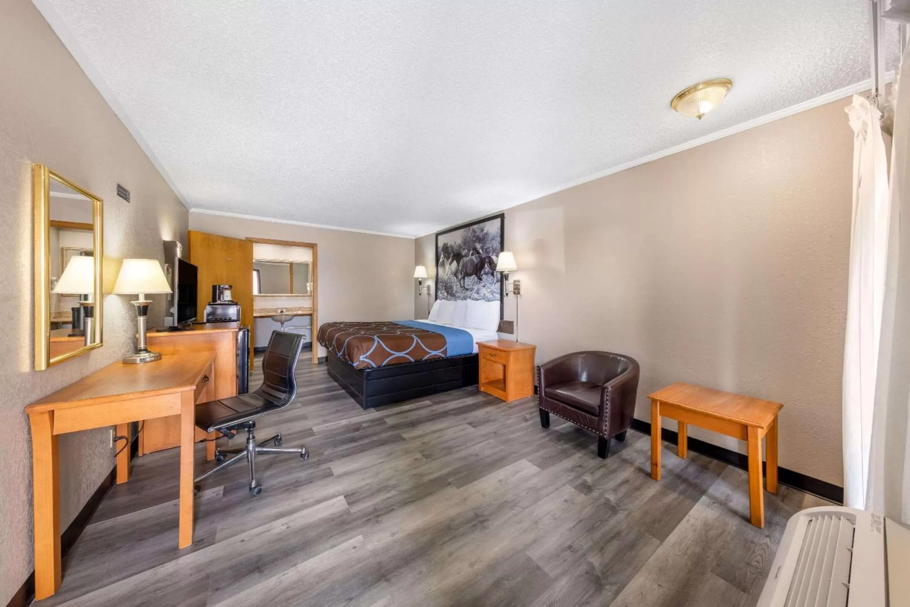 Bedroom, Seating Area in Super 8 by Wyndham Kansas City Airport North