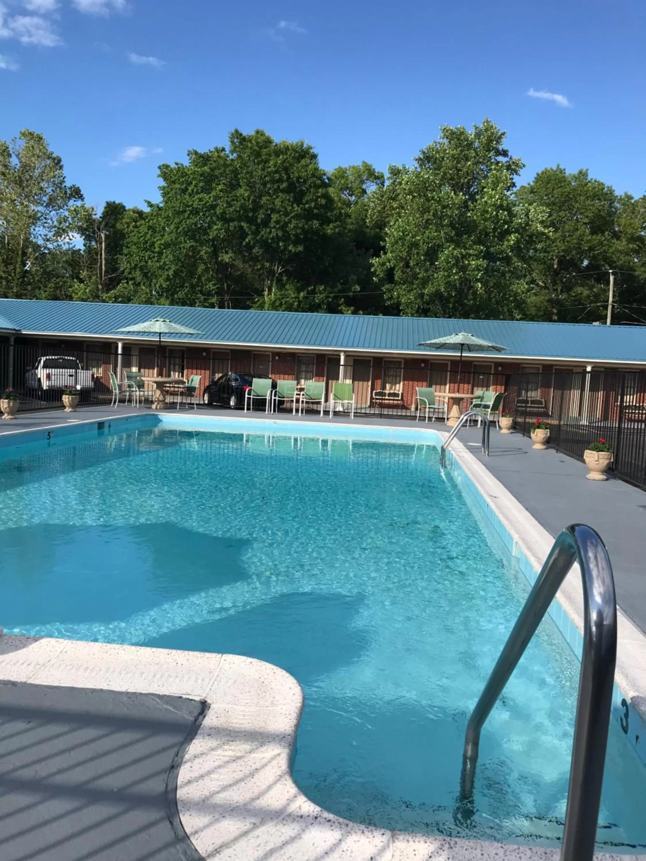 Swimming pool in MERRIMAC INN & SUITES