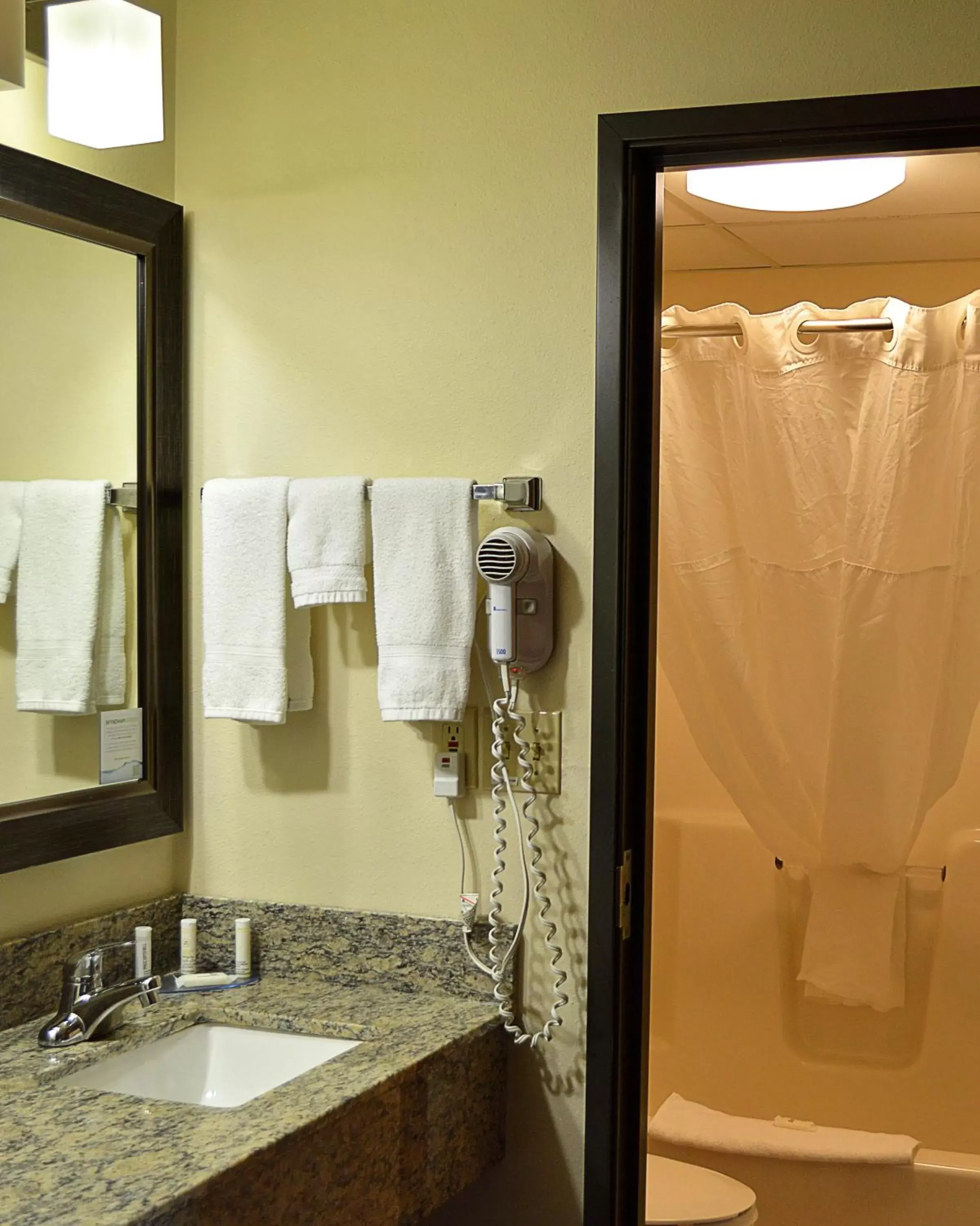 Bathroom in AmericInn by Wyndham Spencer