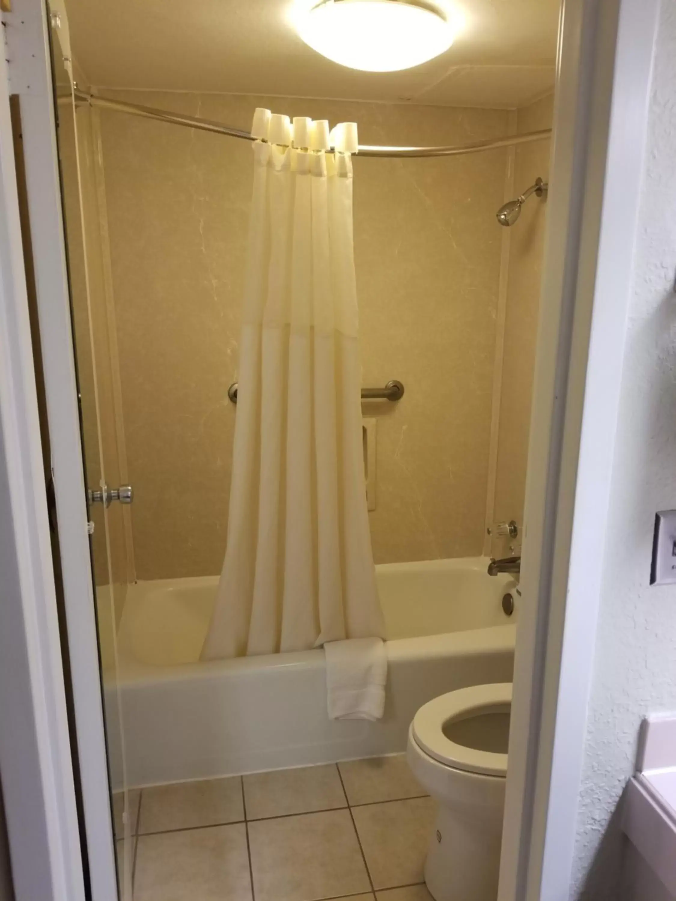 Bathroom in Super 8 by Wyndham Longview/North