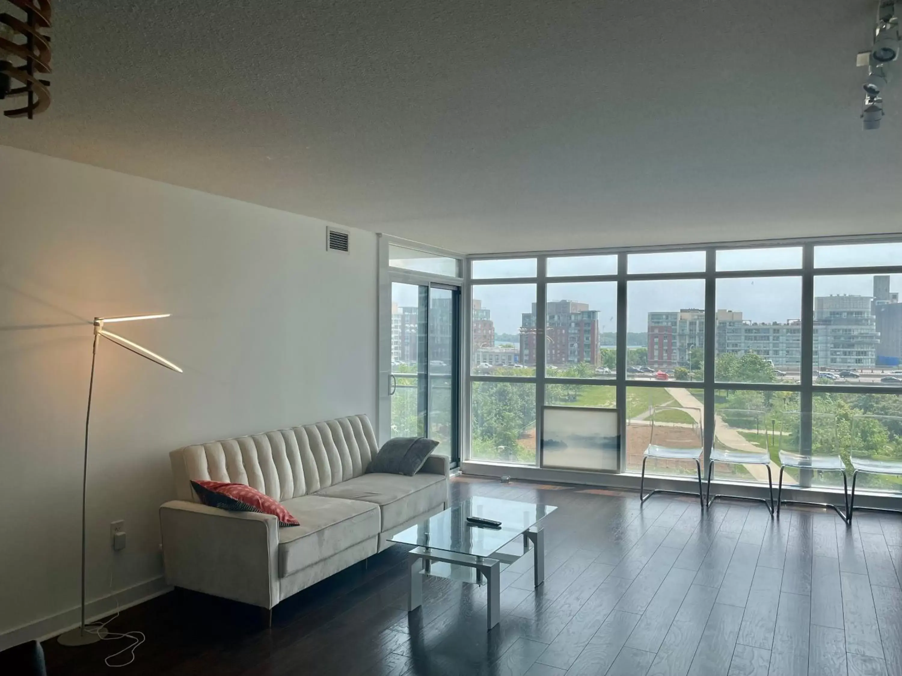 Seating Area in Three BR Condo step to CN tower Rogers Center with Free parking