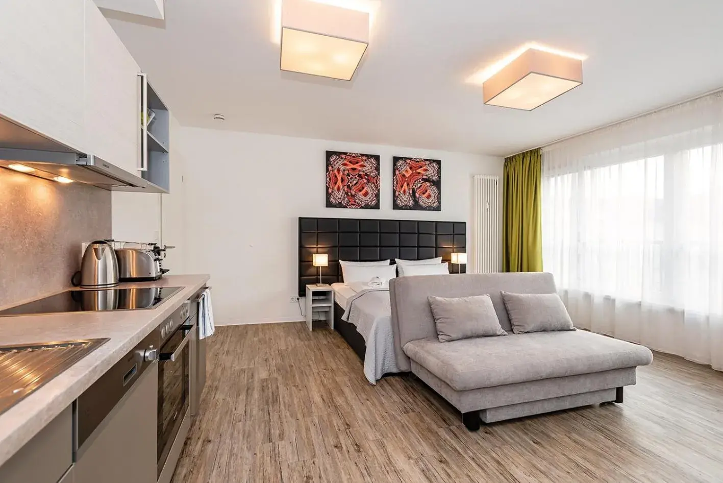 Bed, Seating Area in Apartments Rosenthal Residence