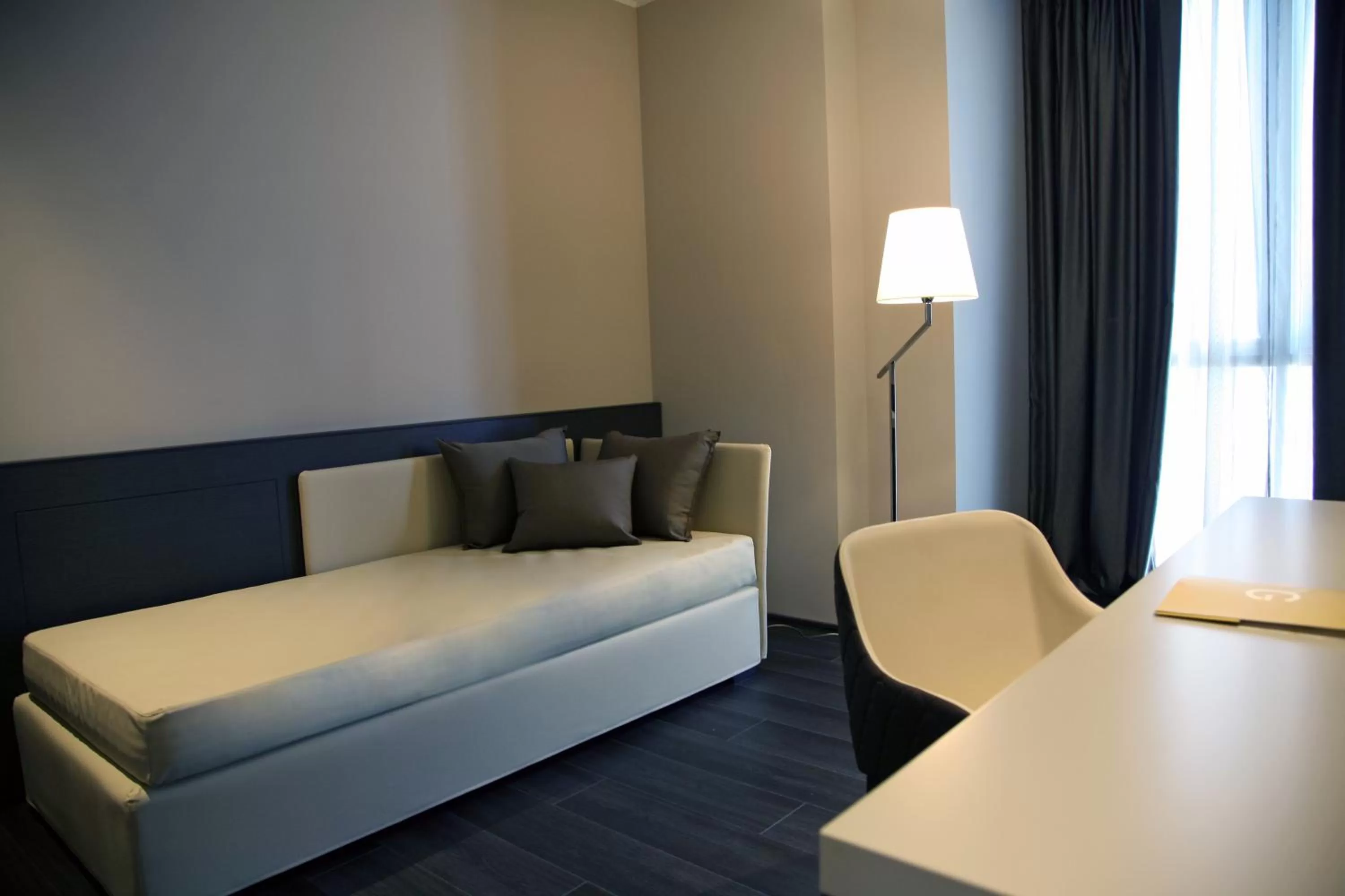 Seating area, Bed in Ego Hotel