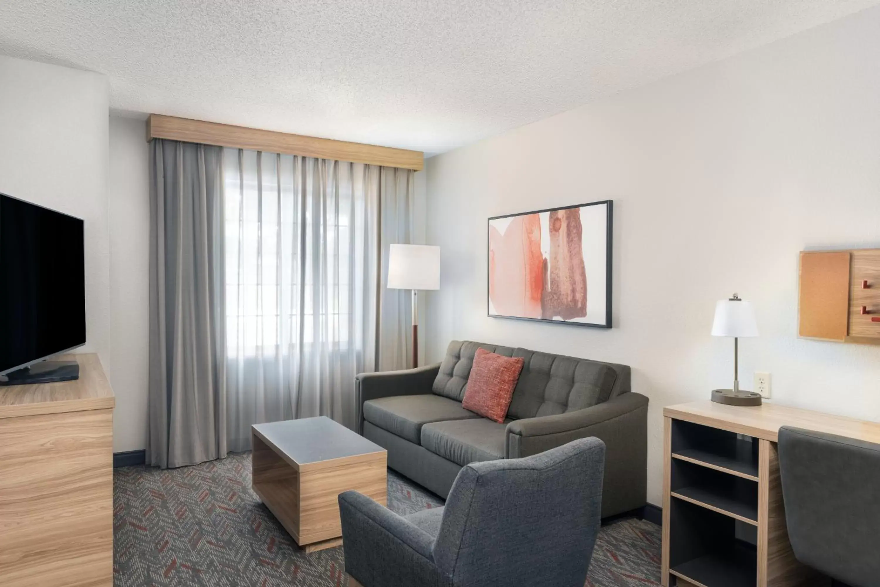 Living room, Seating Area in Candlewood Suites Eagan - Mall of America Area, an IHG Hotel