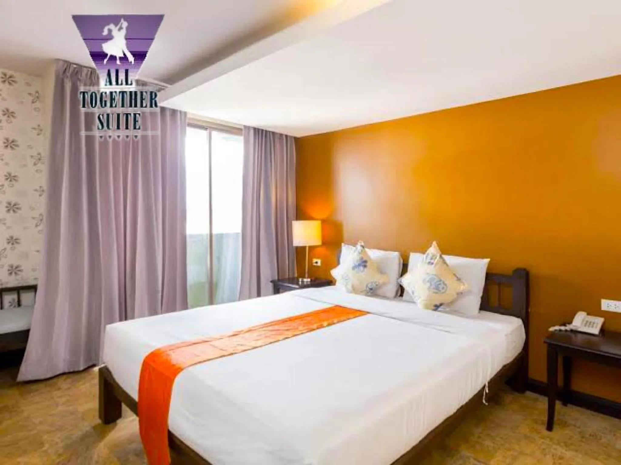 Bed in All Together Suite Hotel