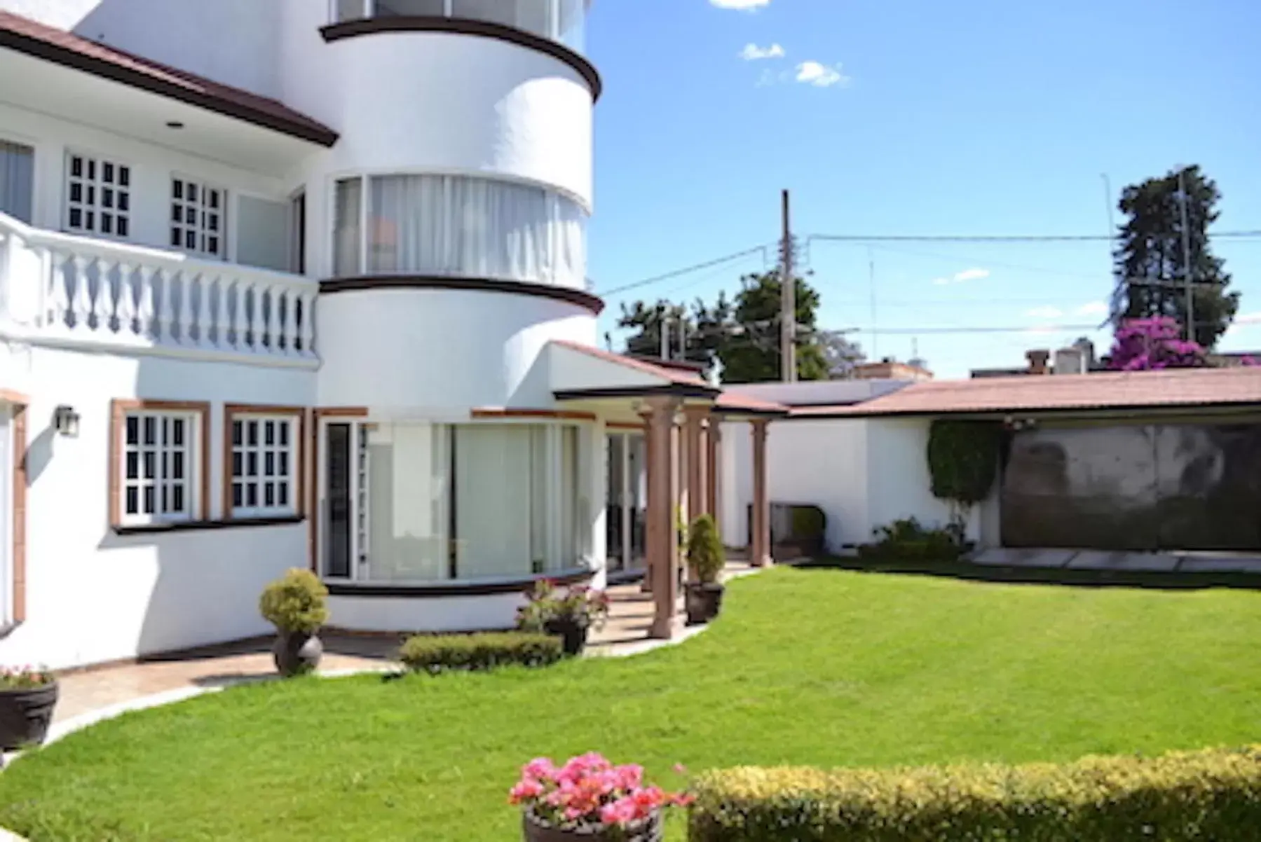 Patio, Property Building in La Aurora Hotel Like Home