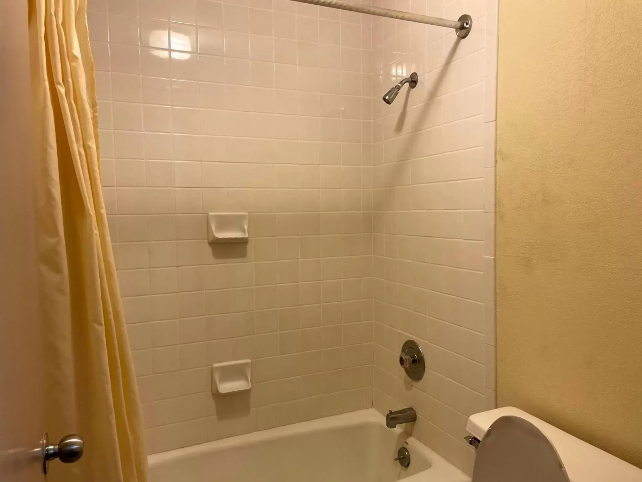 Bathroom in Travelers Inn & Suites Bathroom in Travelers Inn & Suites