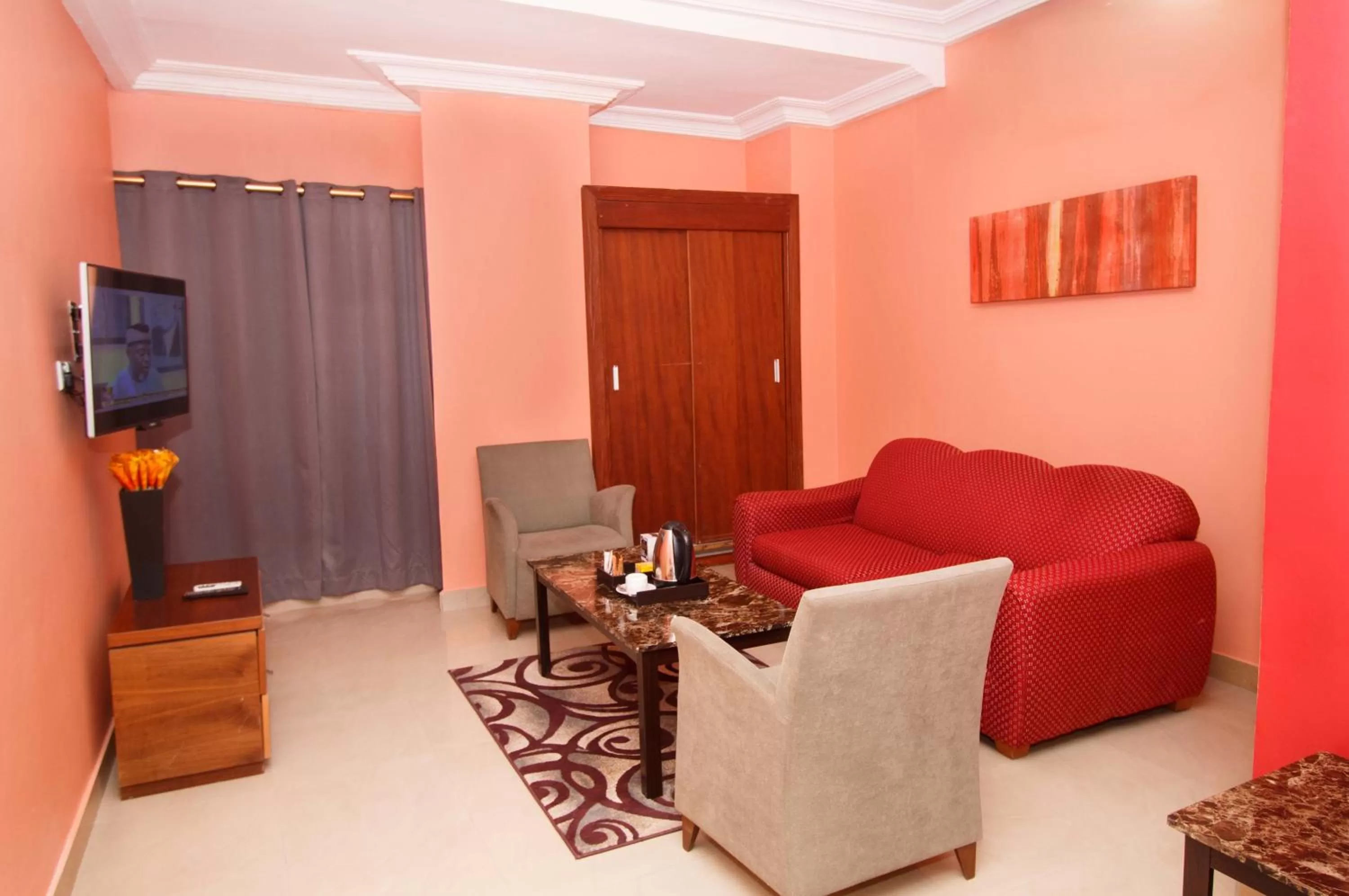 Communal lounge/ TV room in Prestige Suites