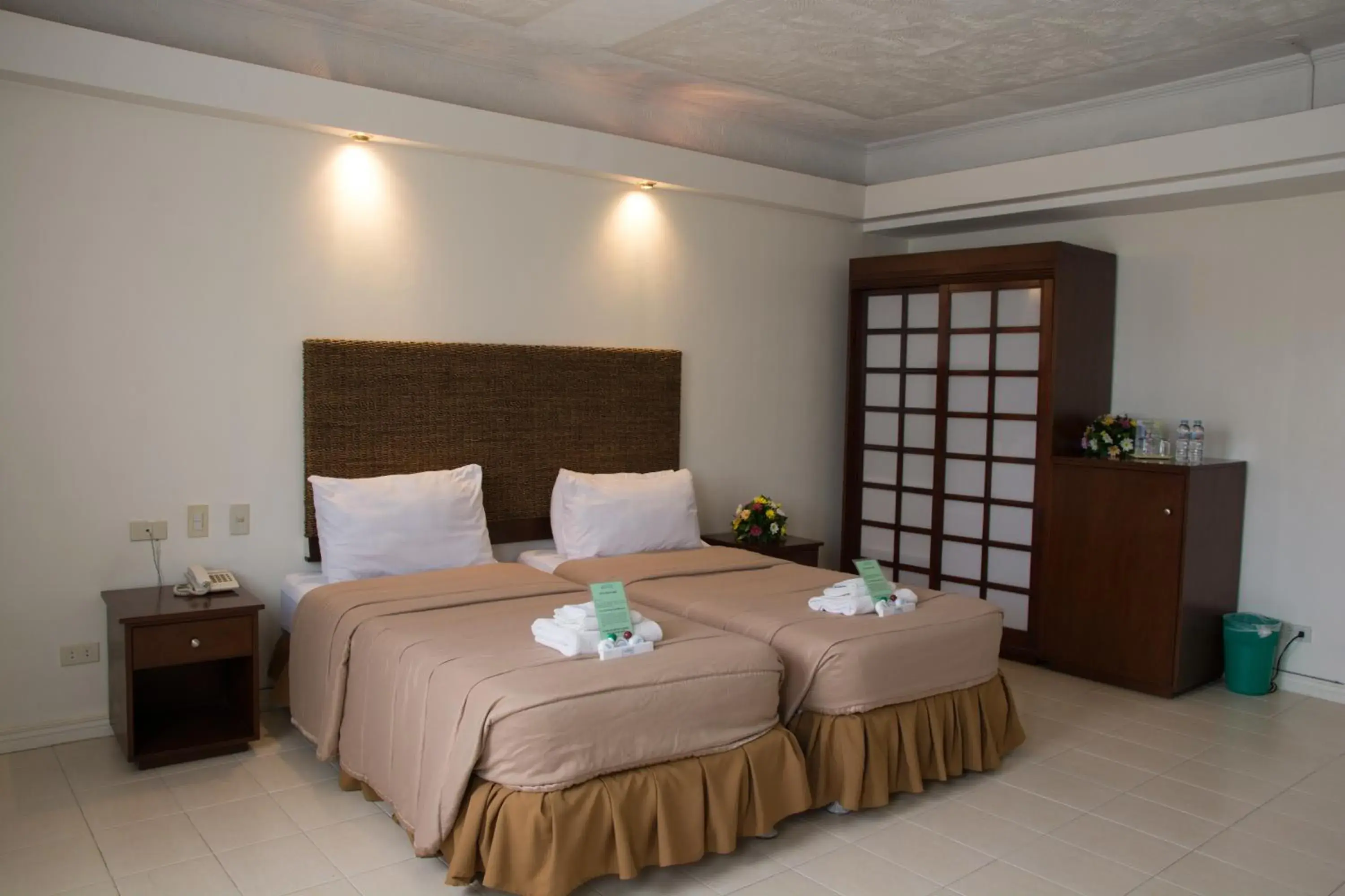 Bed in Wild Orchid Beach Resort