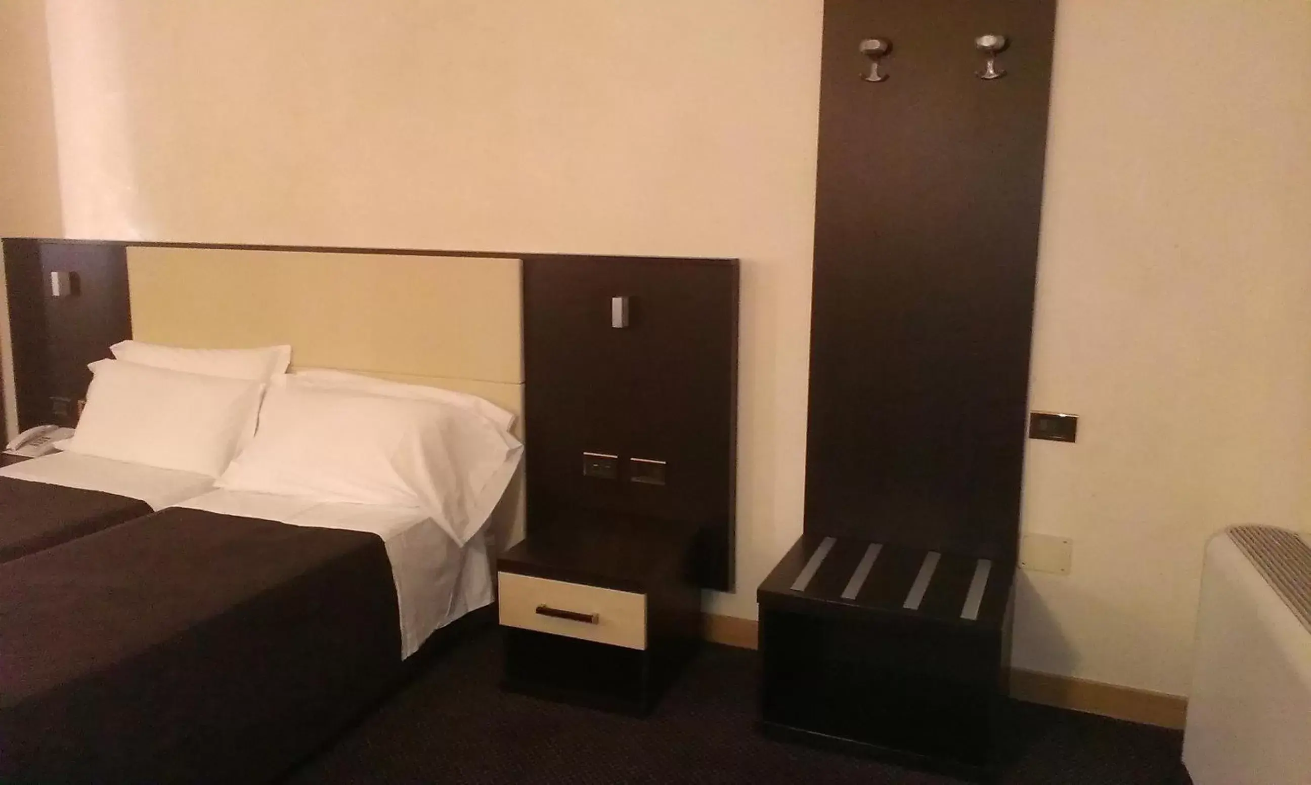 Bed in Hotel Tritone