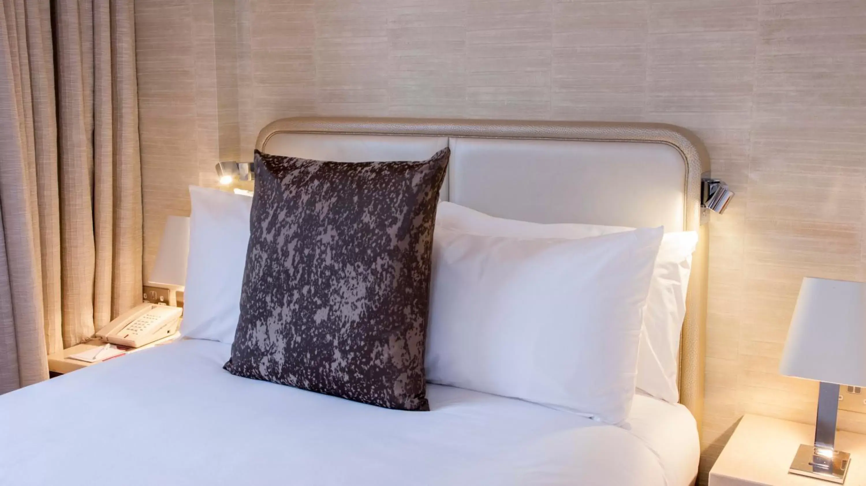 Bed in Crowne Plaza London Kings Cross, an IHG Hotel