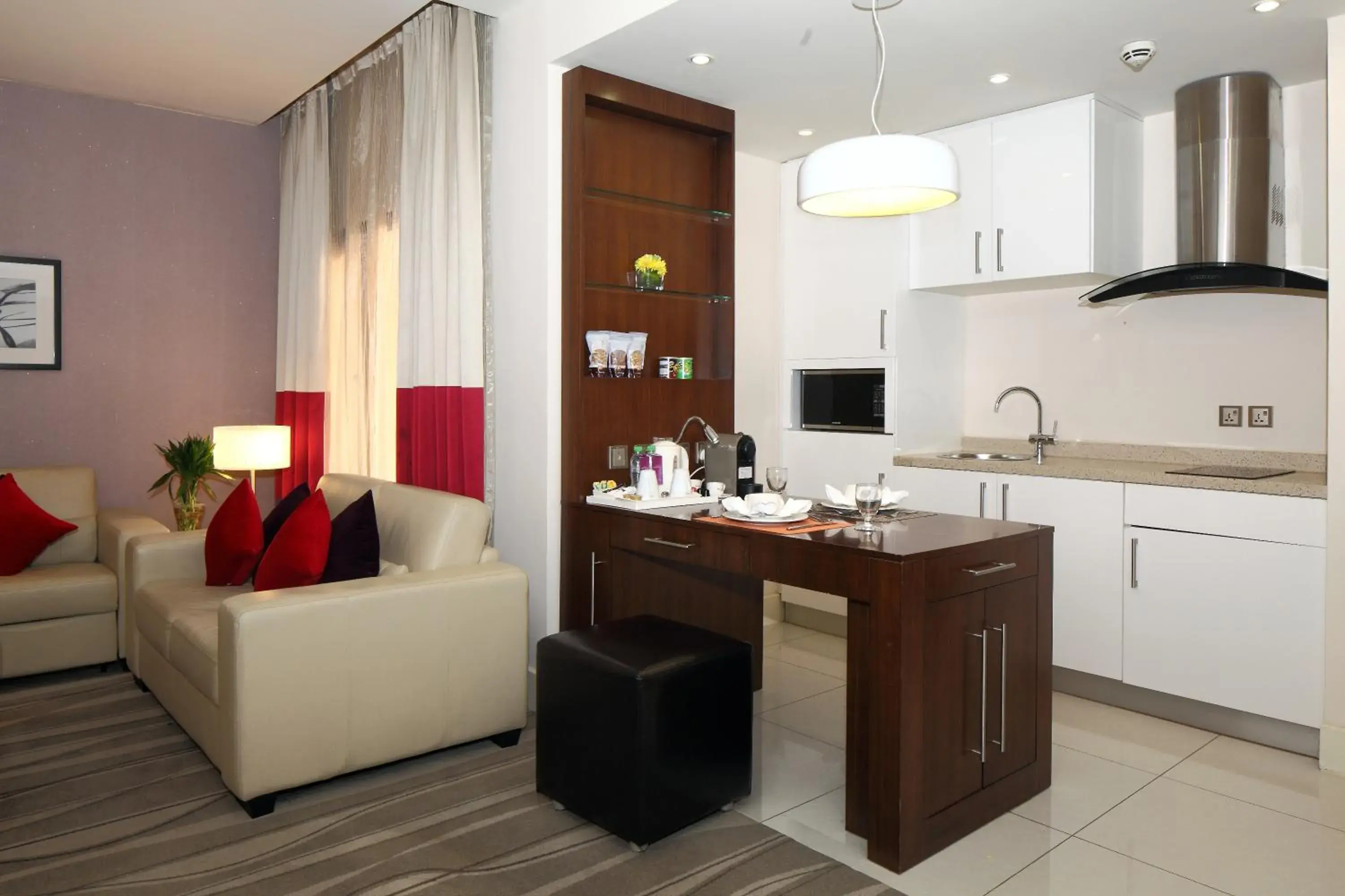 Living room, Kitchen/Kitchenette in Novotel Suites Riyadh Olaya