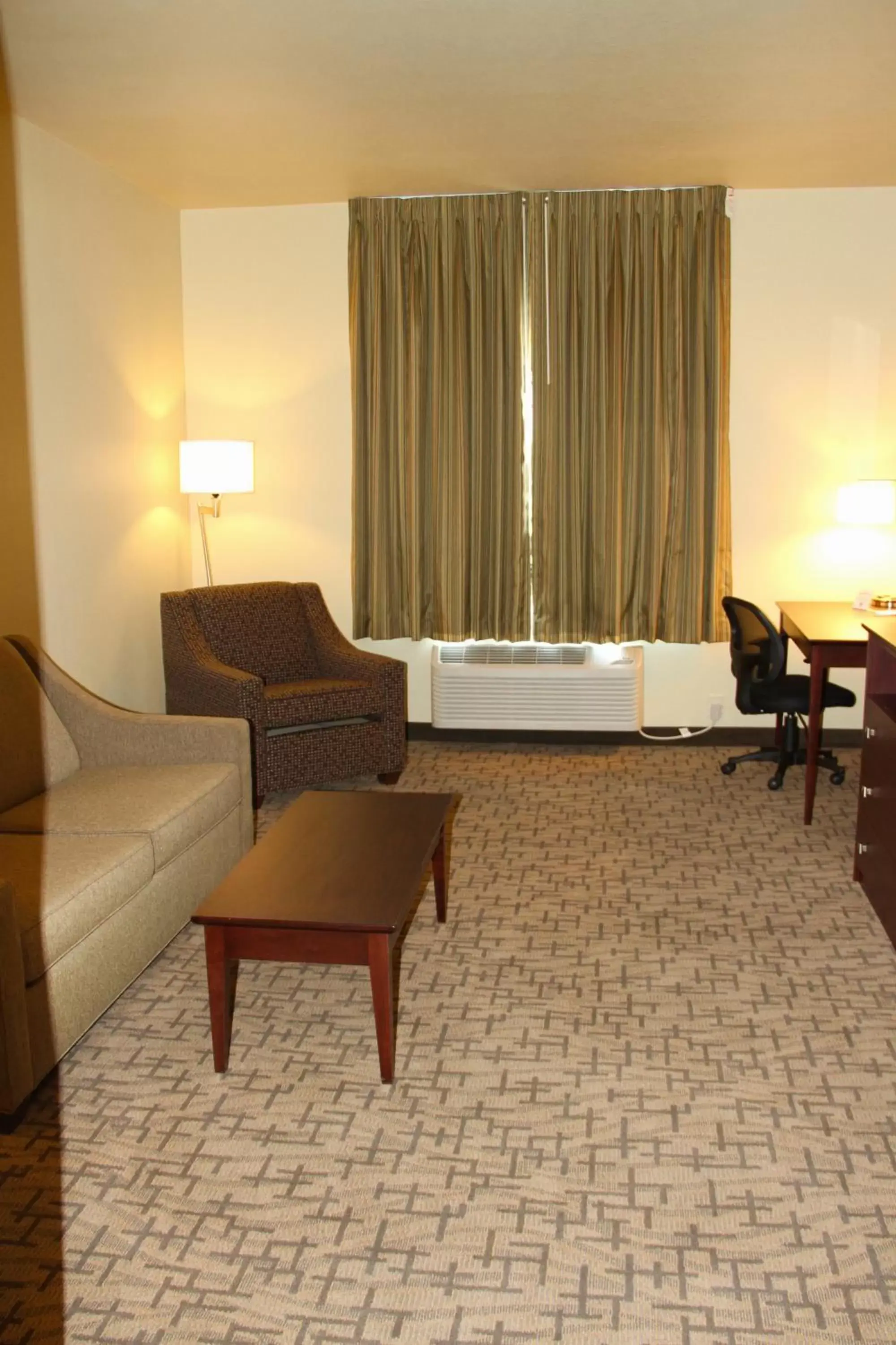 Living room, Seating Area in Cobblestone Hotel & Suites - Devils Lake