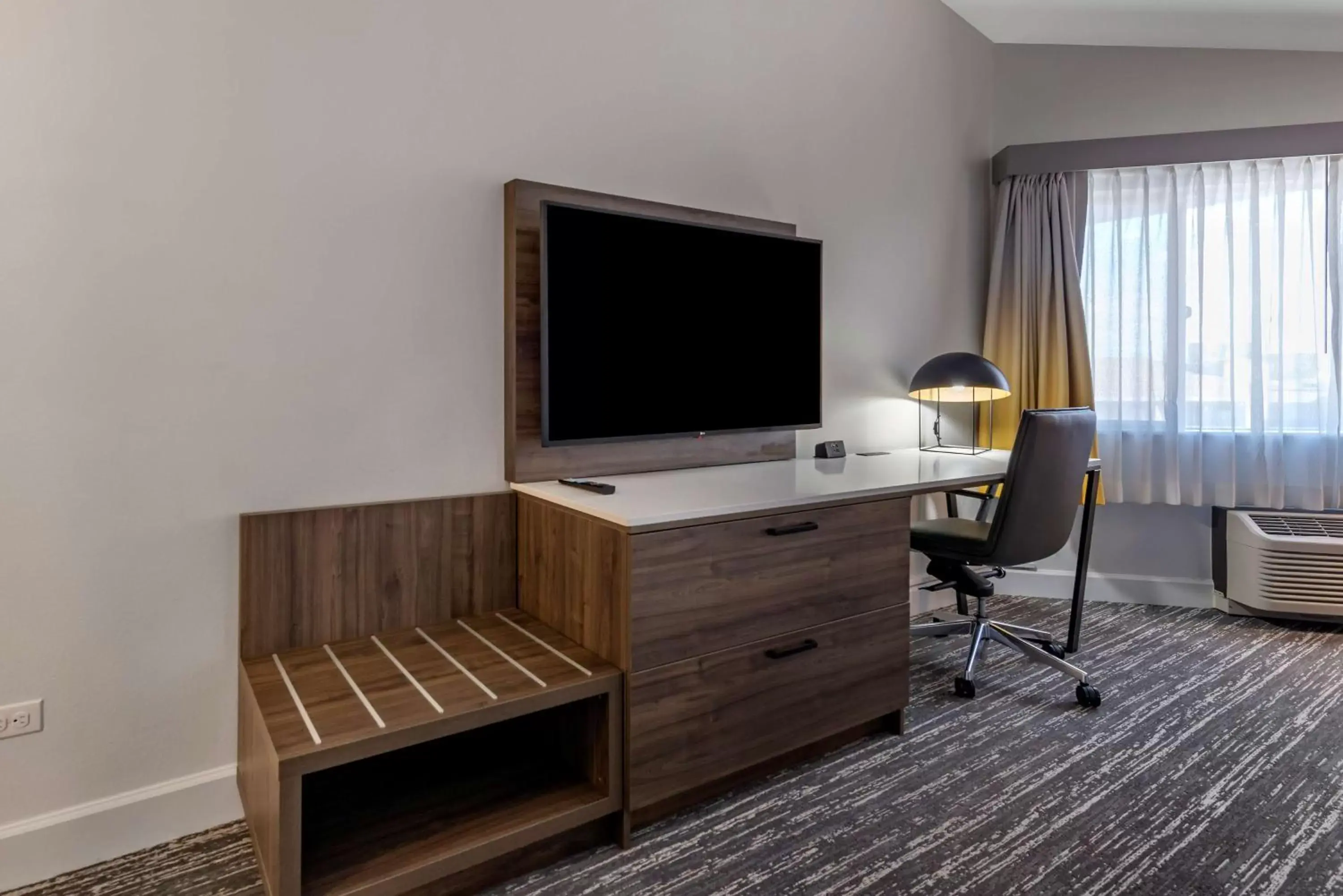 Photo of the whole room, TV/Entertainment Center in Best Western Premier Denver East